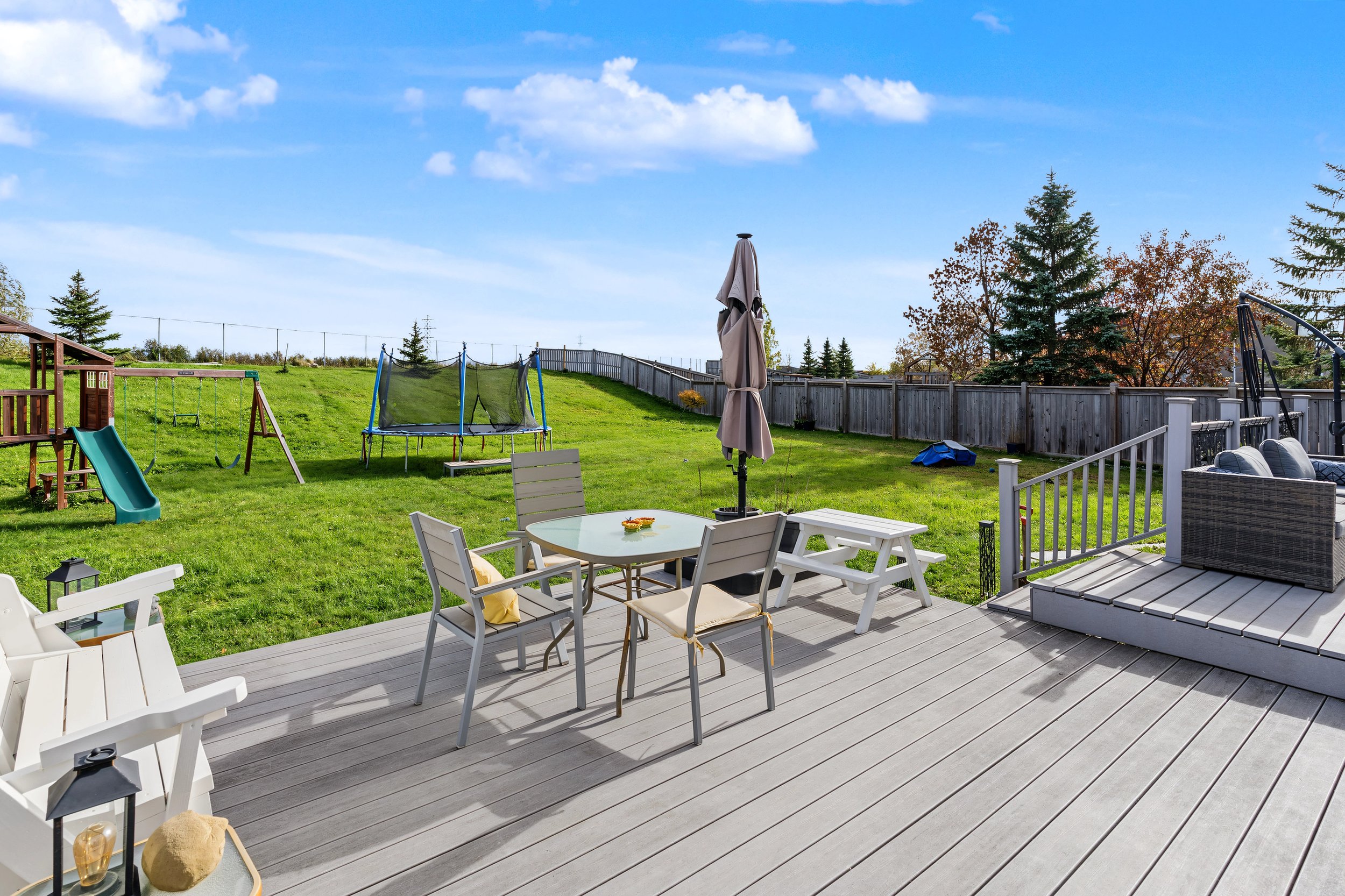 033 Composite deck overlooking the oversized backyard.jpeg