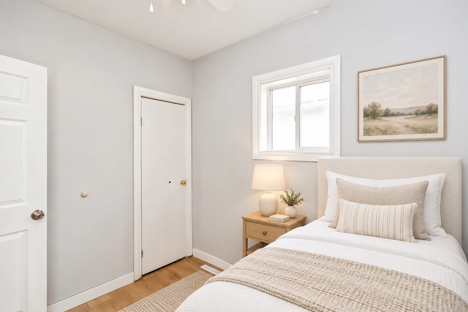 Light-filled small bedroom with a single bed.jpeg