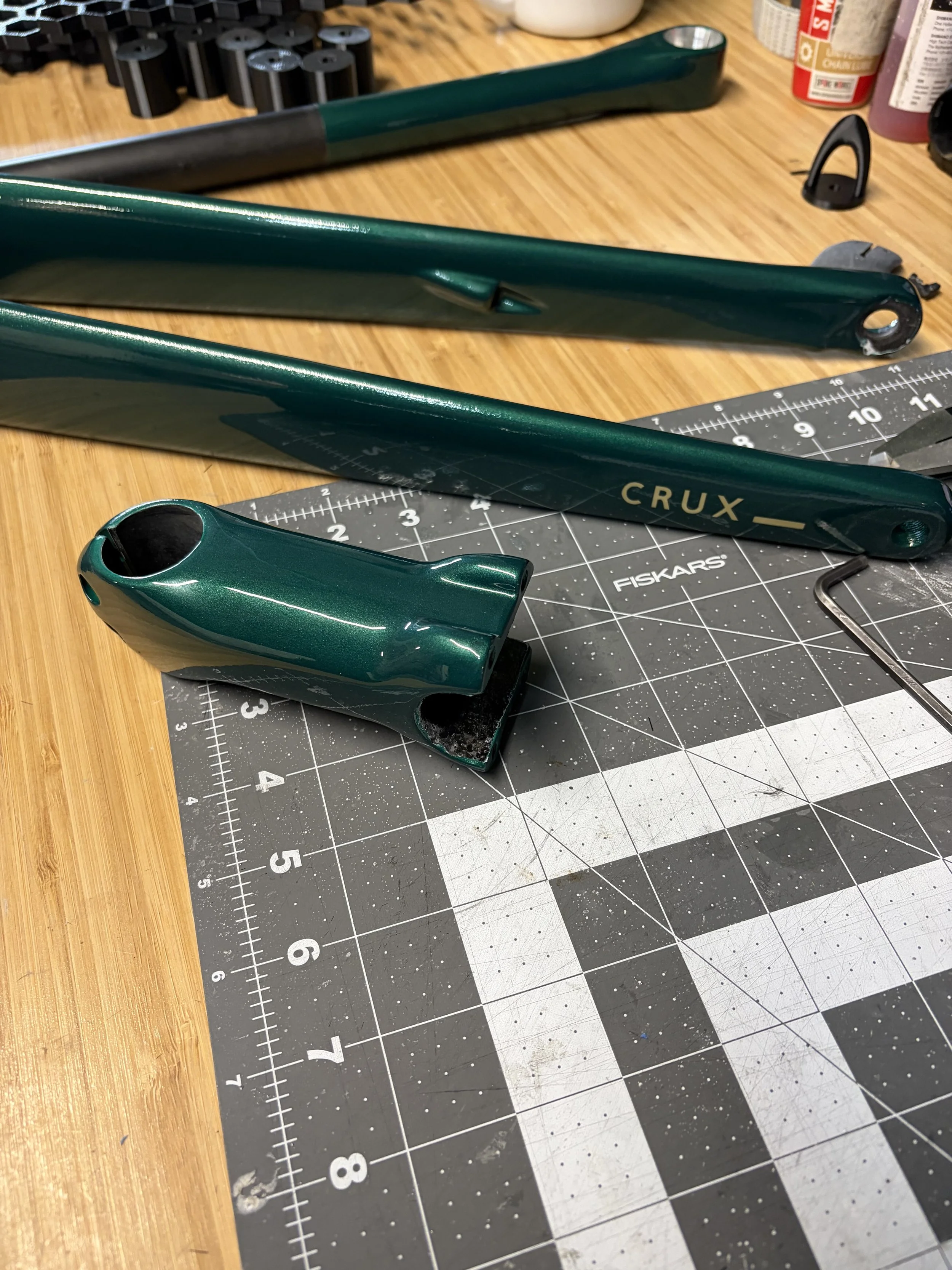 Custom painted bicycle fork, seatpost, and stem.