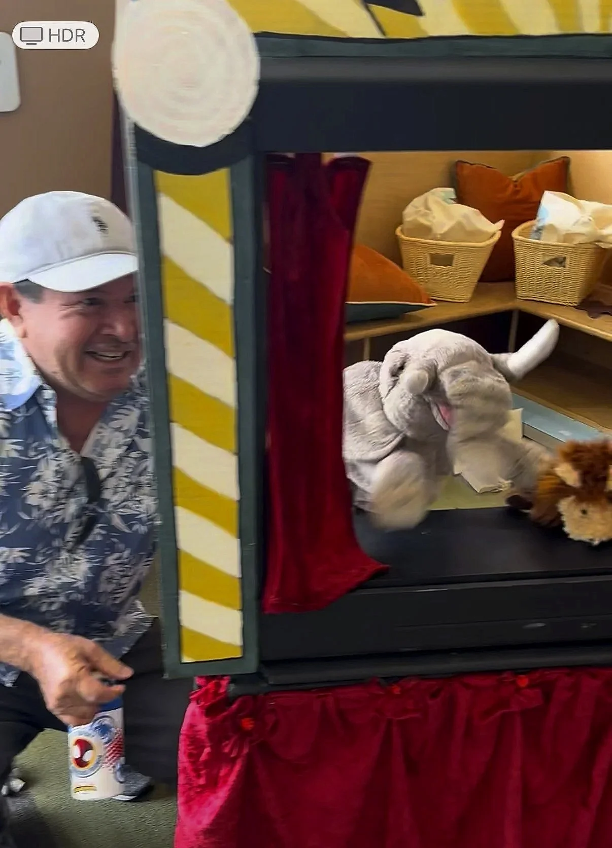 My dad, the original alchemist of laughter, crouched with the elephant in the room △ △ △ but in puppet form.