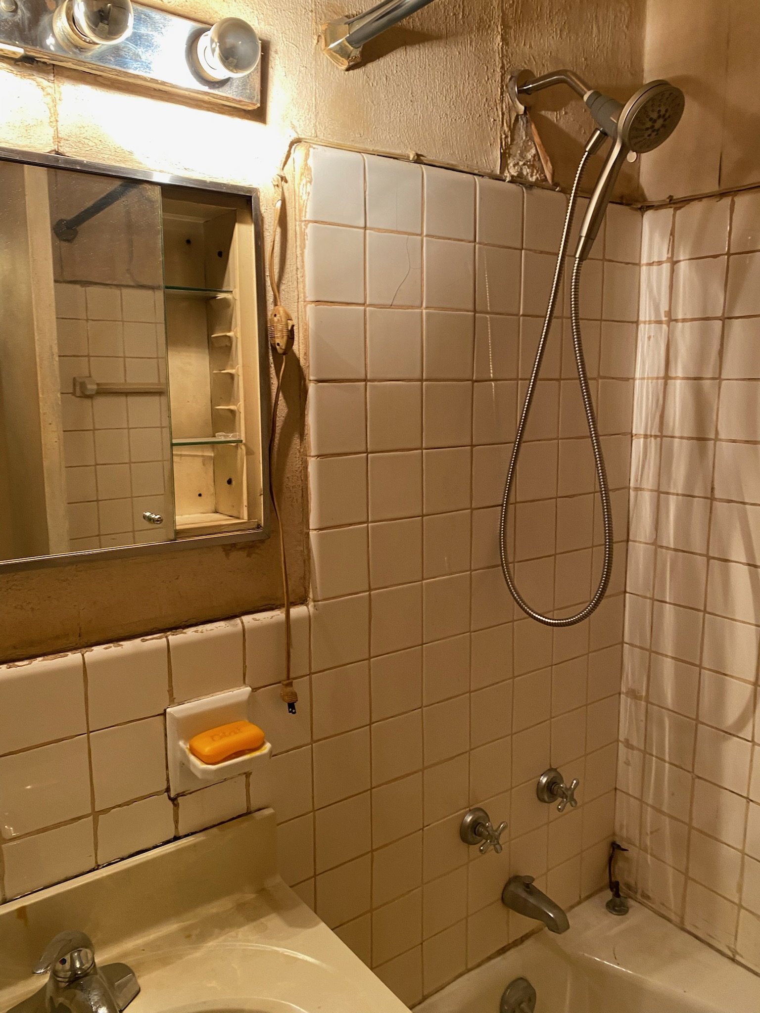 This space had cracked tiles, moisture damage, and exposed wiring. We started from the ground up to bring this Kips Bay bathroom back to life.