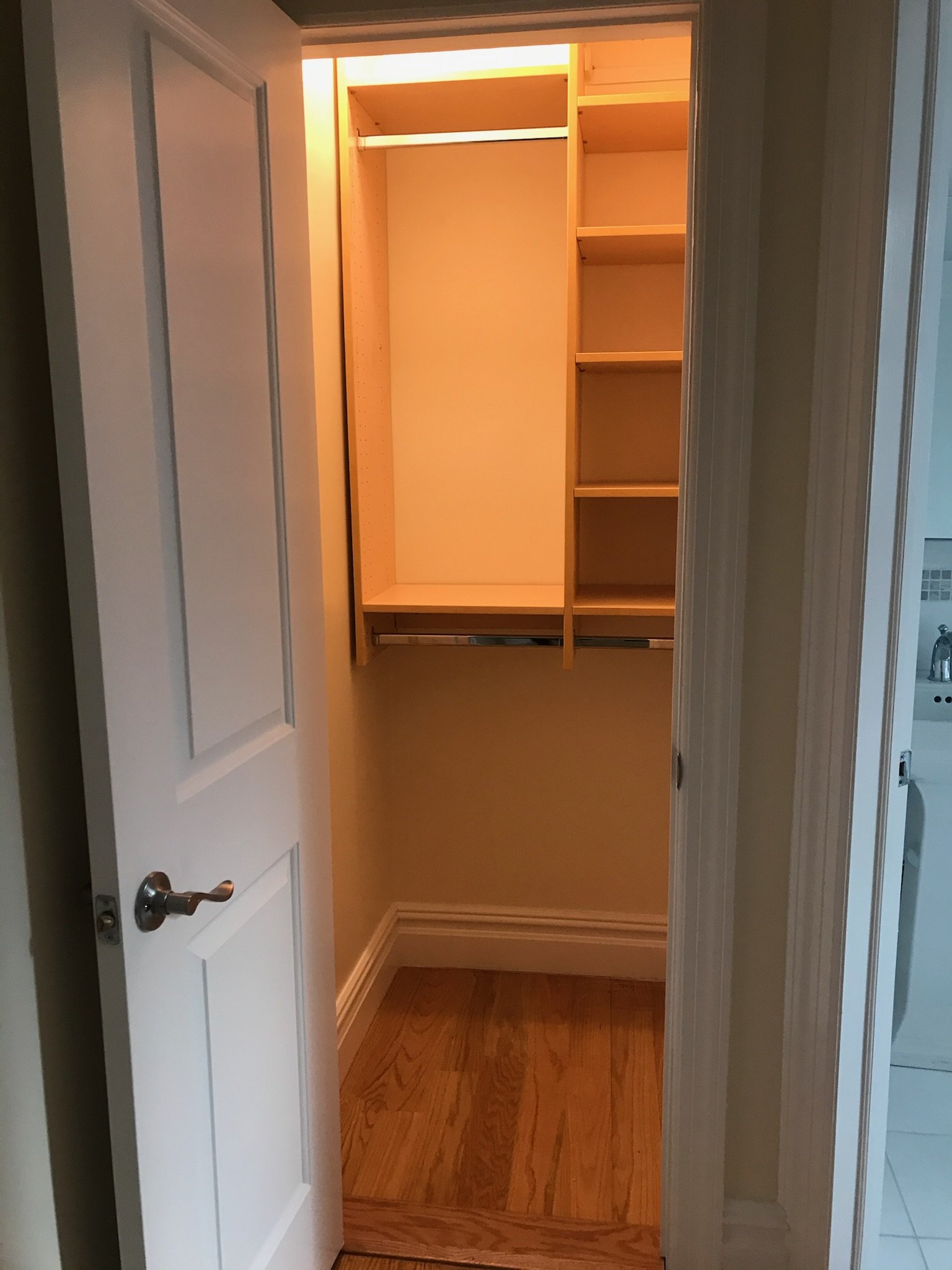 Full closet build-out in West Village unit with integrated lighting and double rod support. Precision cut and polish by At Your Service.