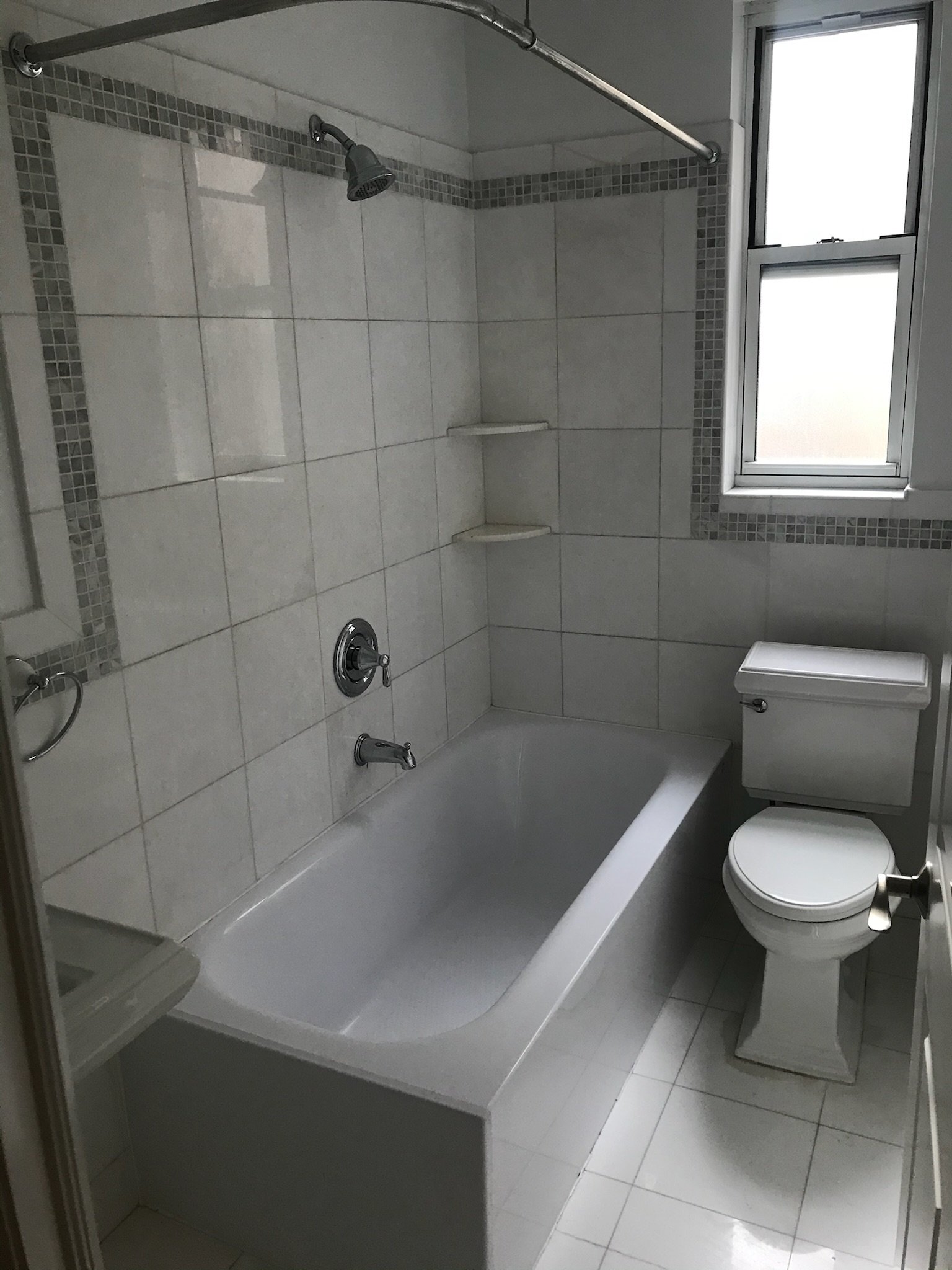 Tile shine restoration and silicone replacement in a West Village bath. Freshened up without needing a full demo.