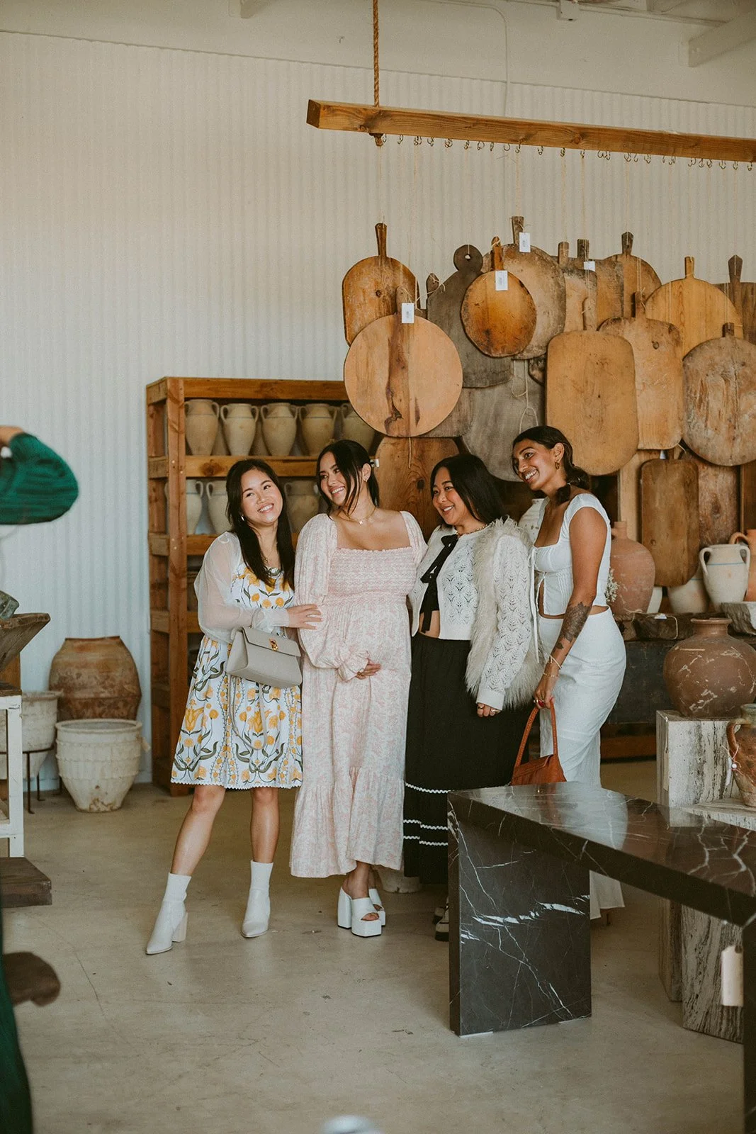Candid shot of pregnant women posing with her guest's at baby shower at Still Interior event space in Costa Mesa — Orange County event photographer Tesla Rae Photo