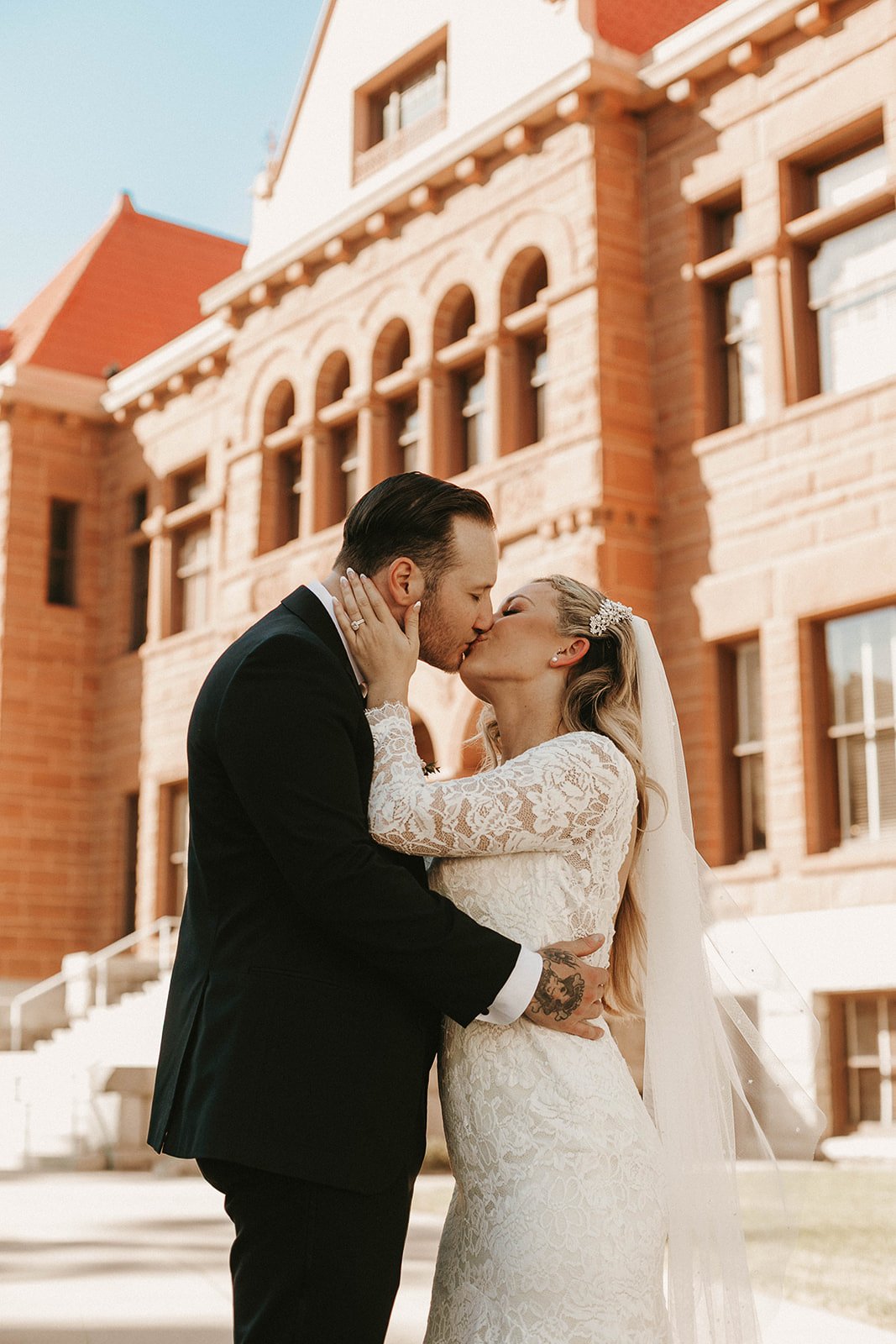 Bride and groom portrait at their courthouse elopement at the Old Orange County Courthouse in Santa Ana — Southern California wedding photographer Tesla Rae Photo based in Huntington Beach