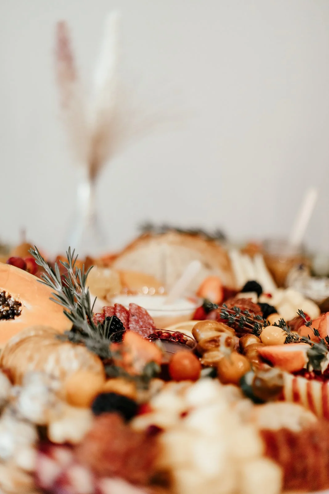 Luxurious table setting details and charcuterie, grazing table at upscale baby shower at Fullerton Arboretum.