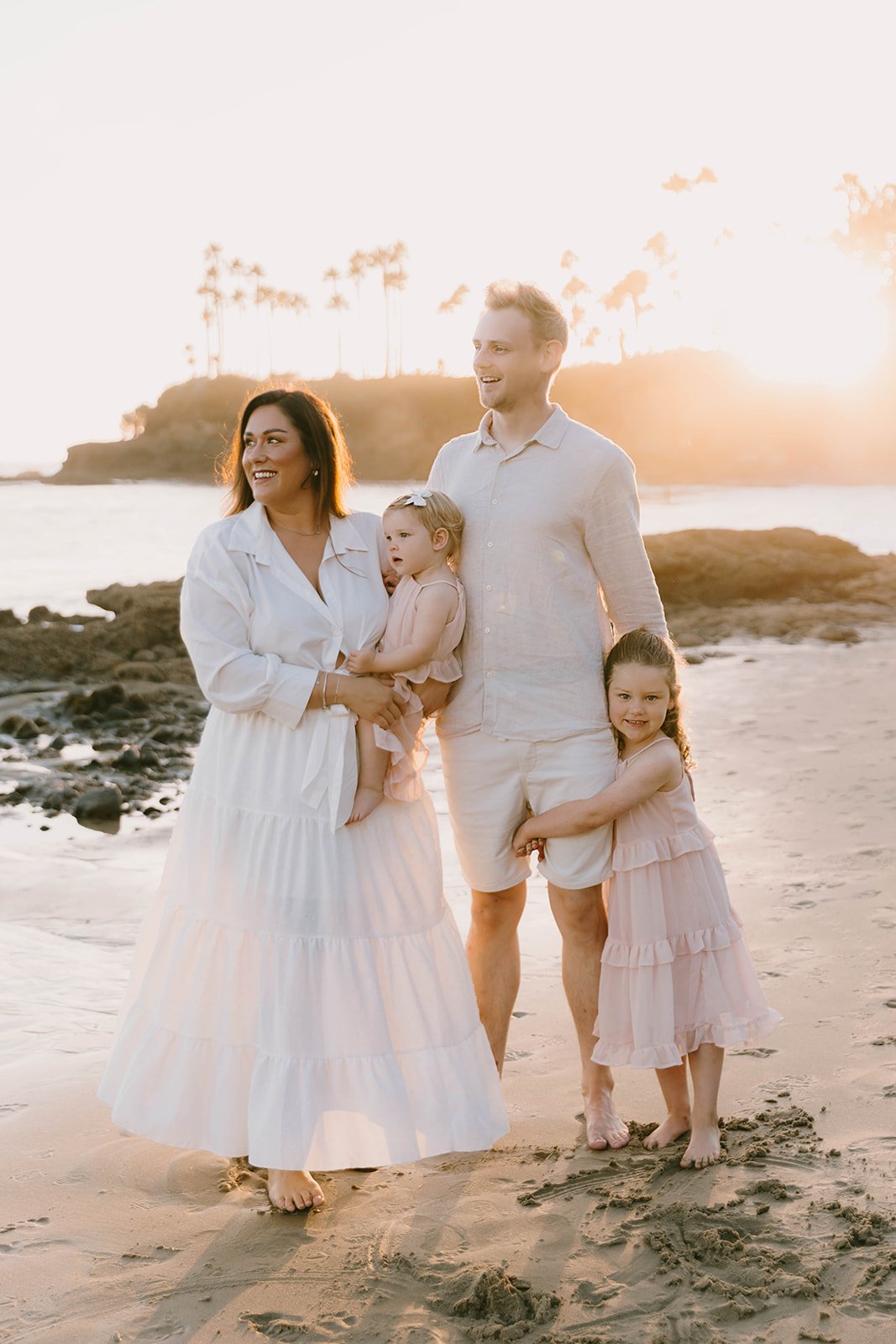 Carefree family laughing and playing at Laguna Beach — Best candid family photographers in Laguna Beach — Captured by Tesla Rae Photo