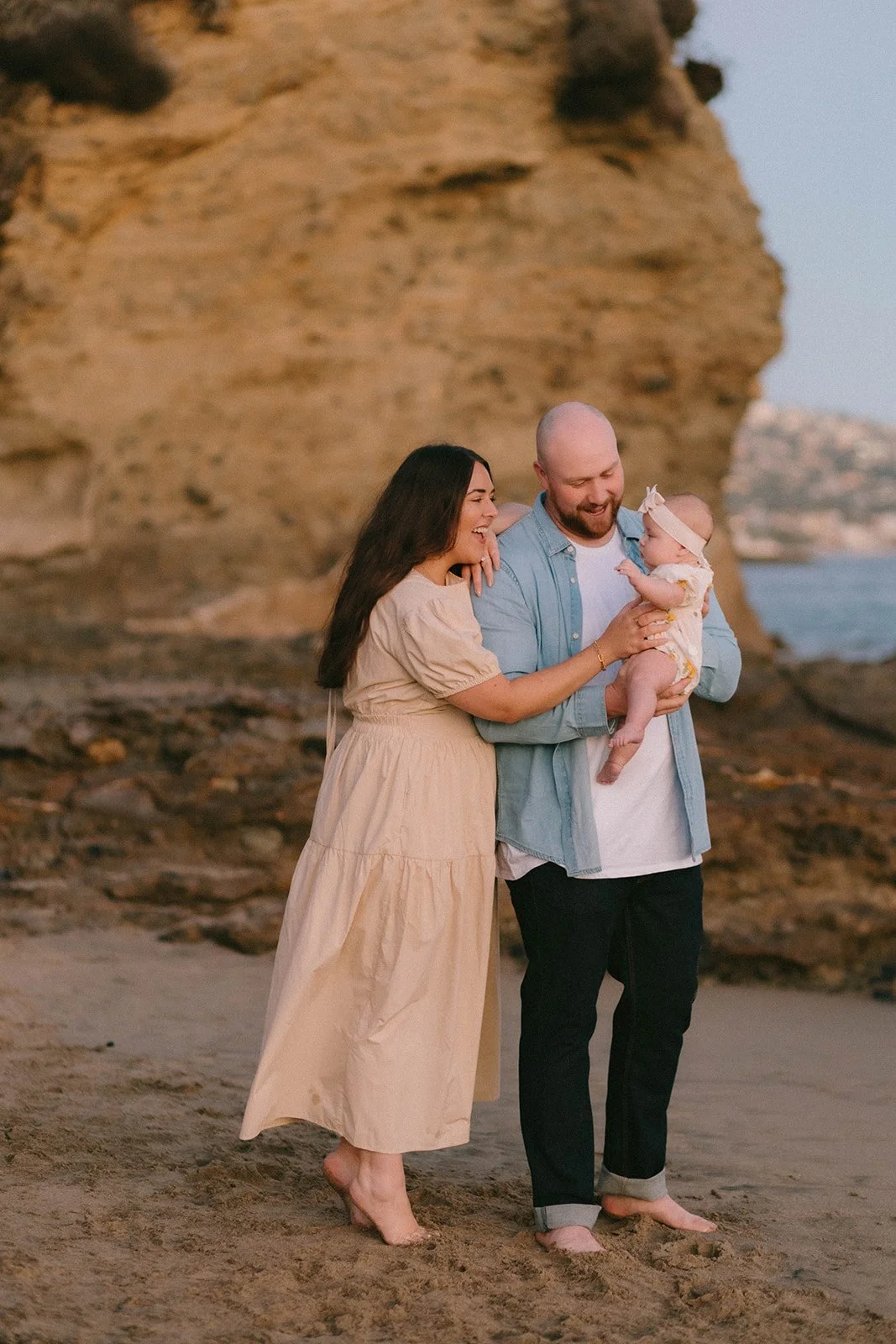 Carefree family laughing and playing at Huntington Beach — Best candid family photographers in Huntington Beach — Captured by Tesla Rae Photo