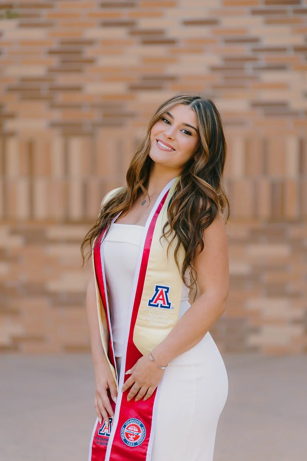 Grad celebrating with lifestyle portraits on Chapman University campus in Orange — Best graduation photographers in Orange County for authentic moments — Captured by Tesla Rae Photo
