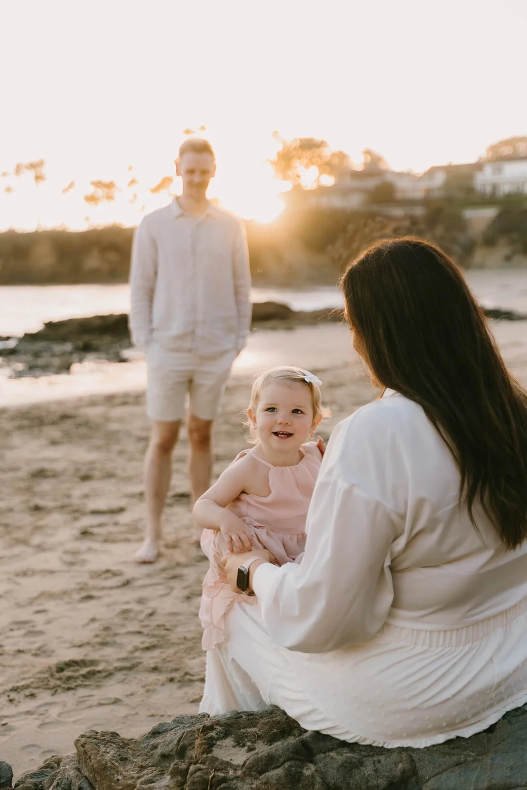 Carefree family laughing and playing at Laguna Beach — Best candid family photographers in Laguna Beach — Captured by Tesla Rae Photo