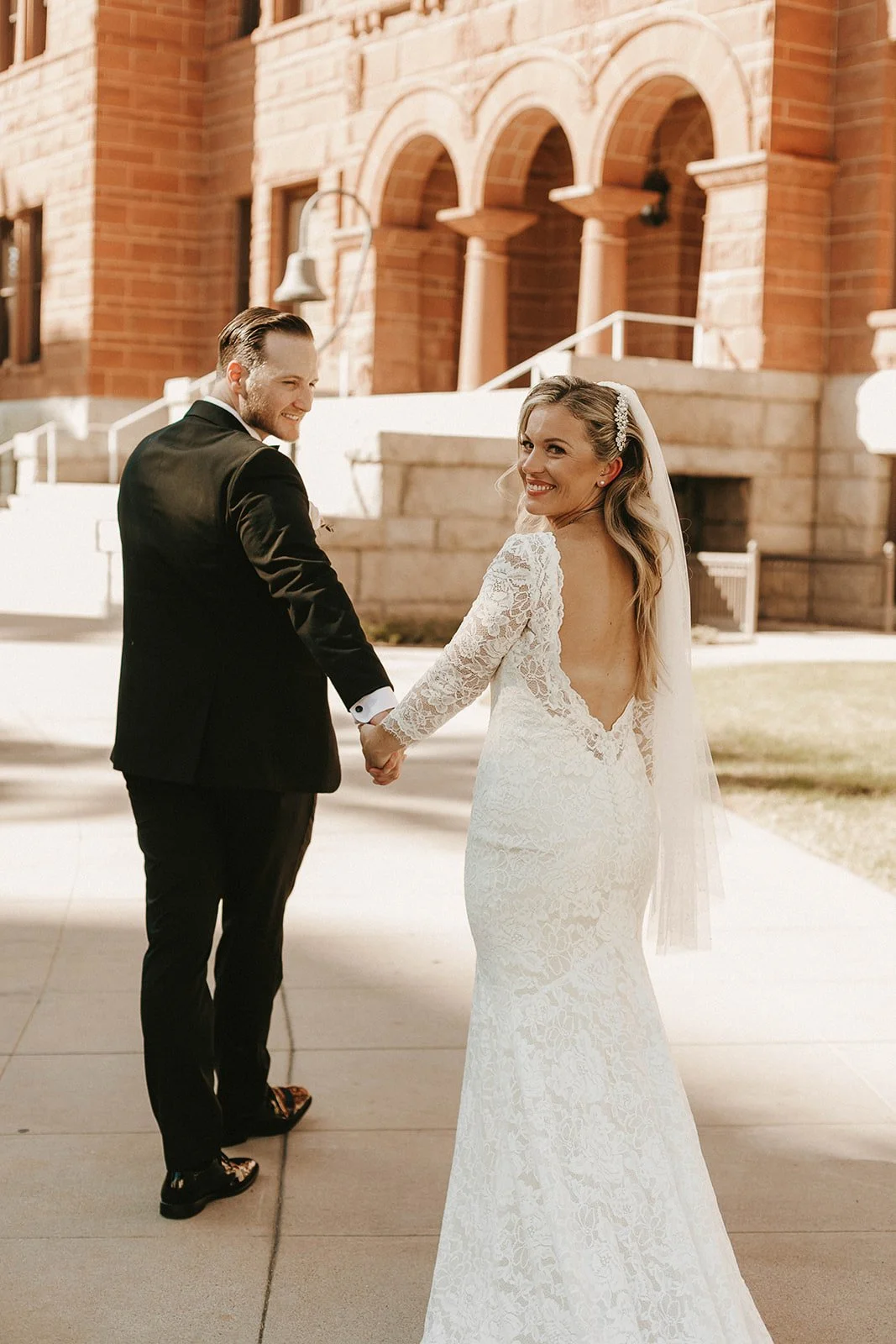Bride and groom portrait at their courthouse elopement at the Old Orange County Courthouse in Santa Ana — Southern California wedding photographer Tesla Rae Photo based in Huntington Beach
