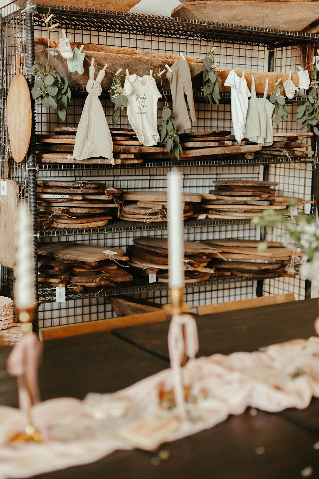 Baby clothes hanging from clothespin at baby shower at Still Interior event space in Costa Mesa — Orange County event photographer Tesla Rae Photo