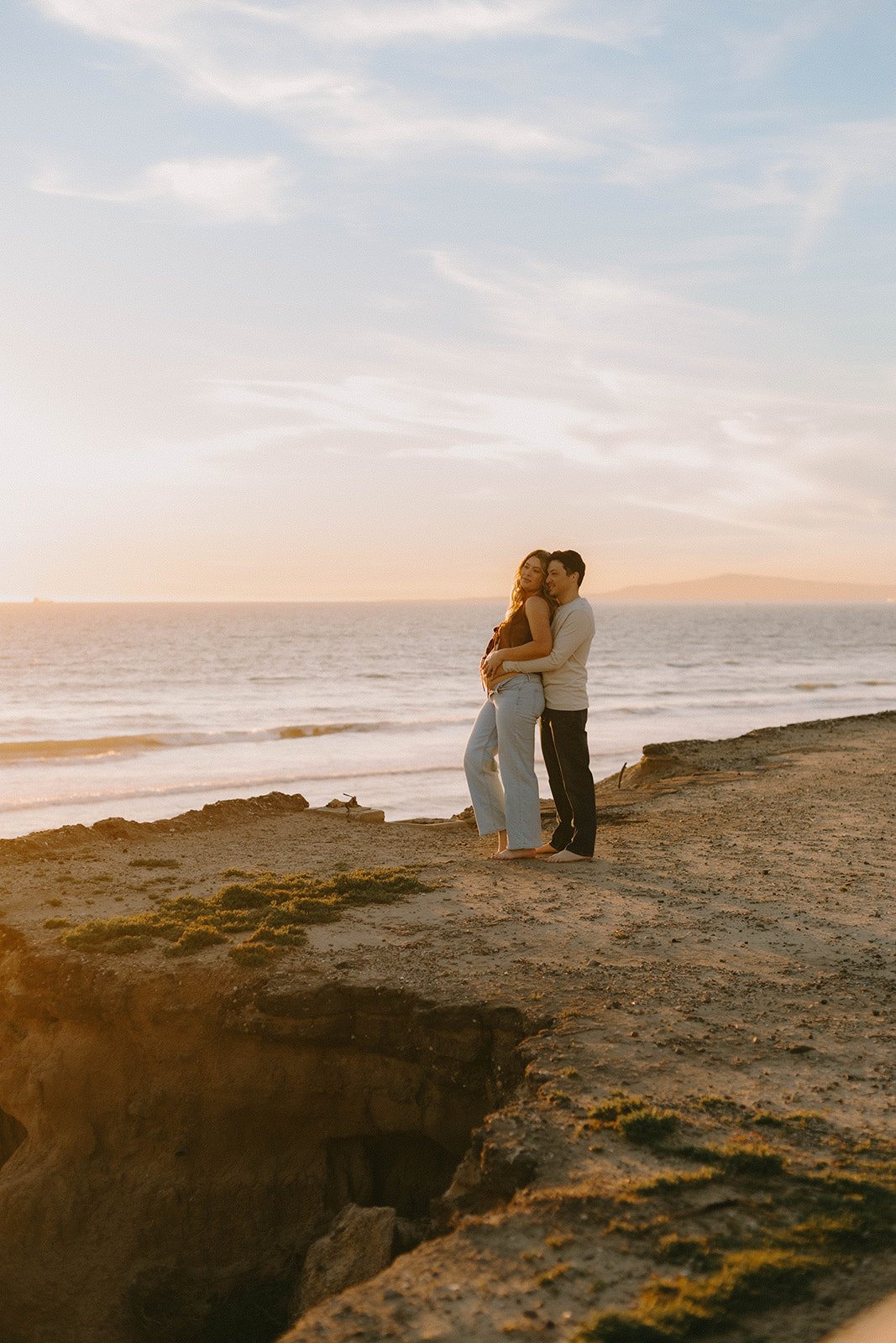 Maternity session at coastal cliffs at sunset on the beach in Huntington Beach  — Best maternity photographers in Orange County — Tesla Rae Photo