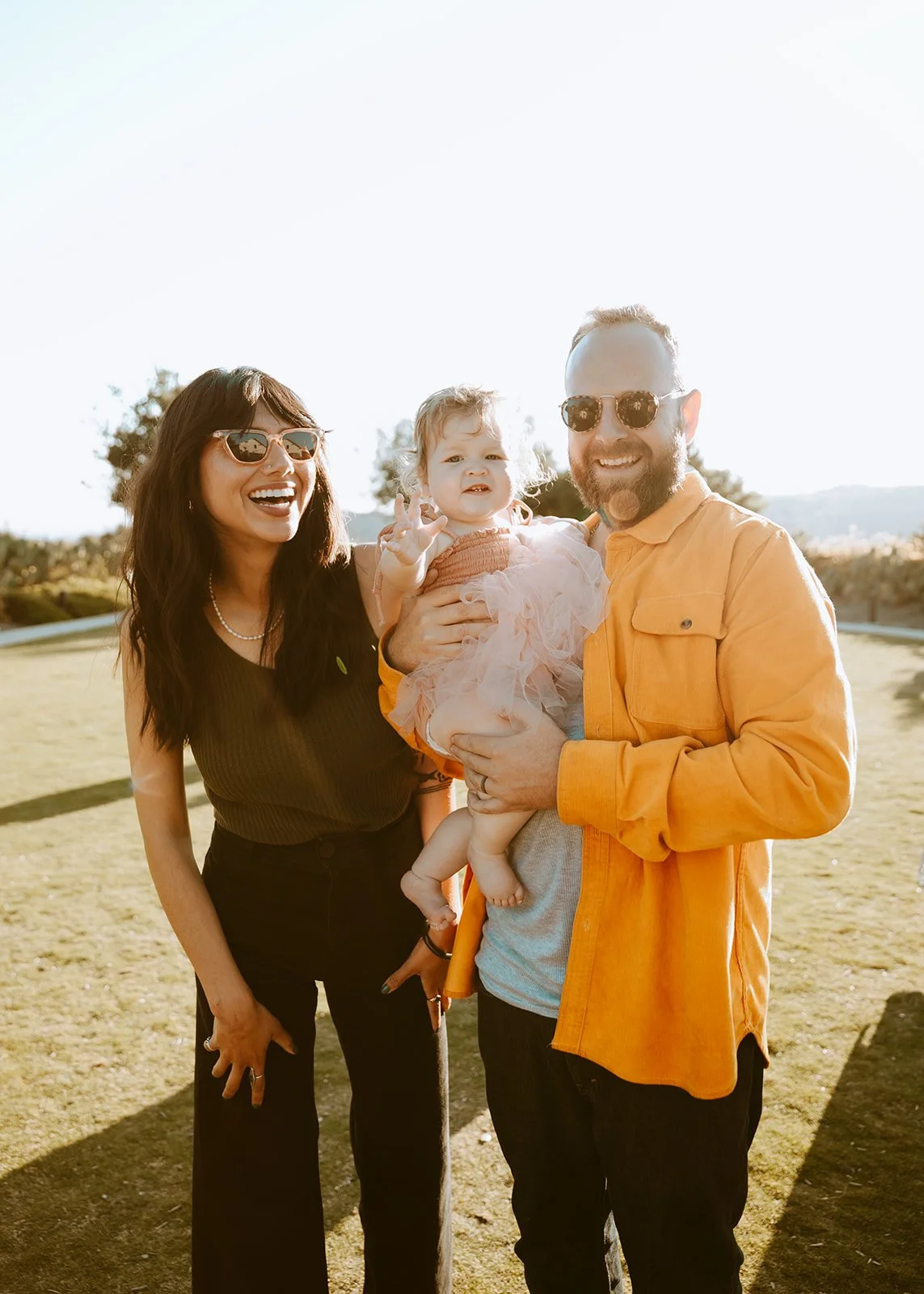 Candid shot of couple with their daughter in Newport Beach — Orange County event photographer Tesla Rae Photo