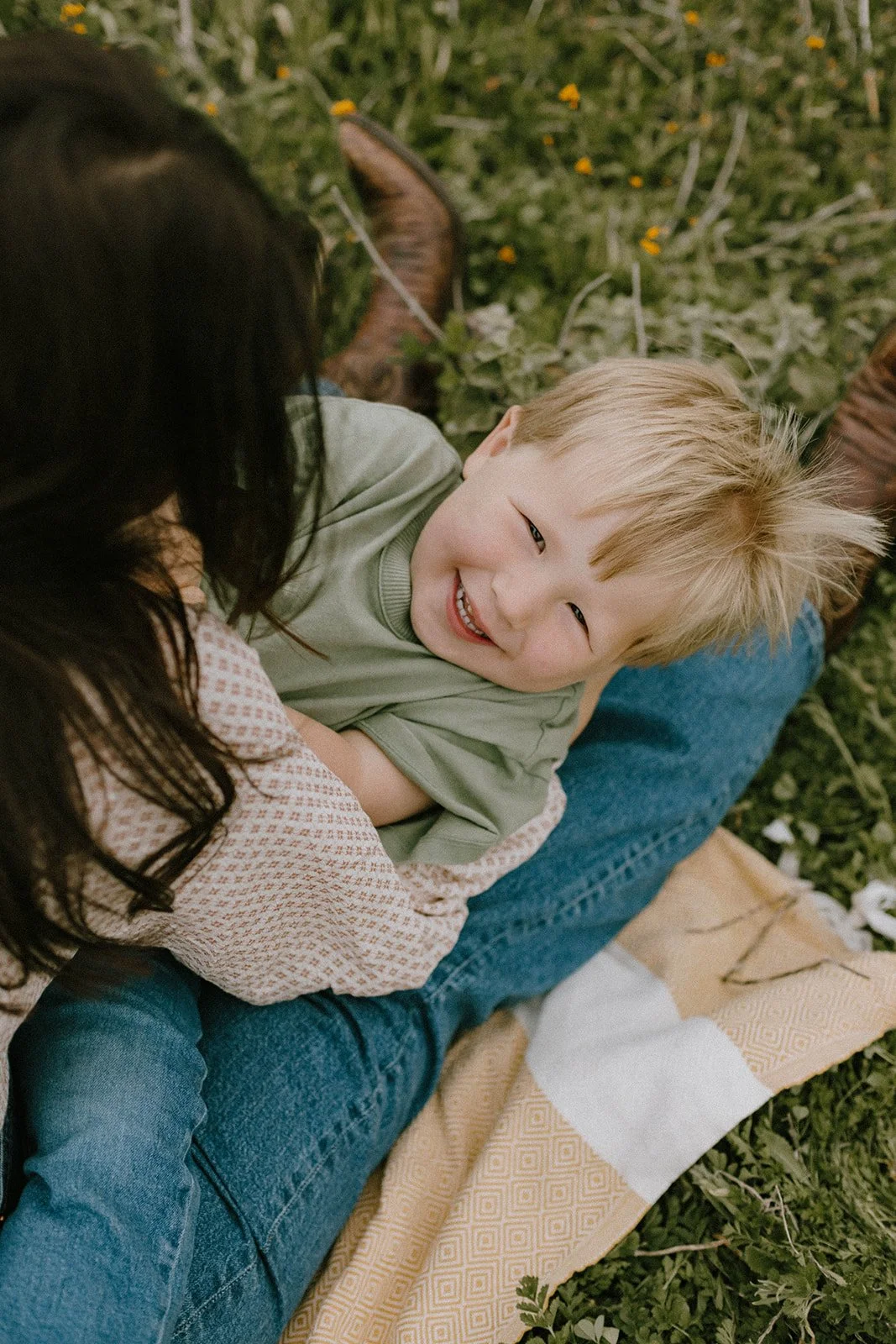 Moody family beach session in Newport Beach featuring a family of four laughing and playing together along the shoreline during their Southern California vacation.