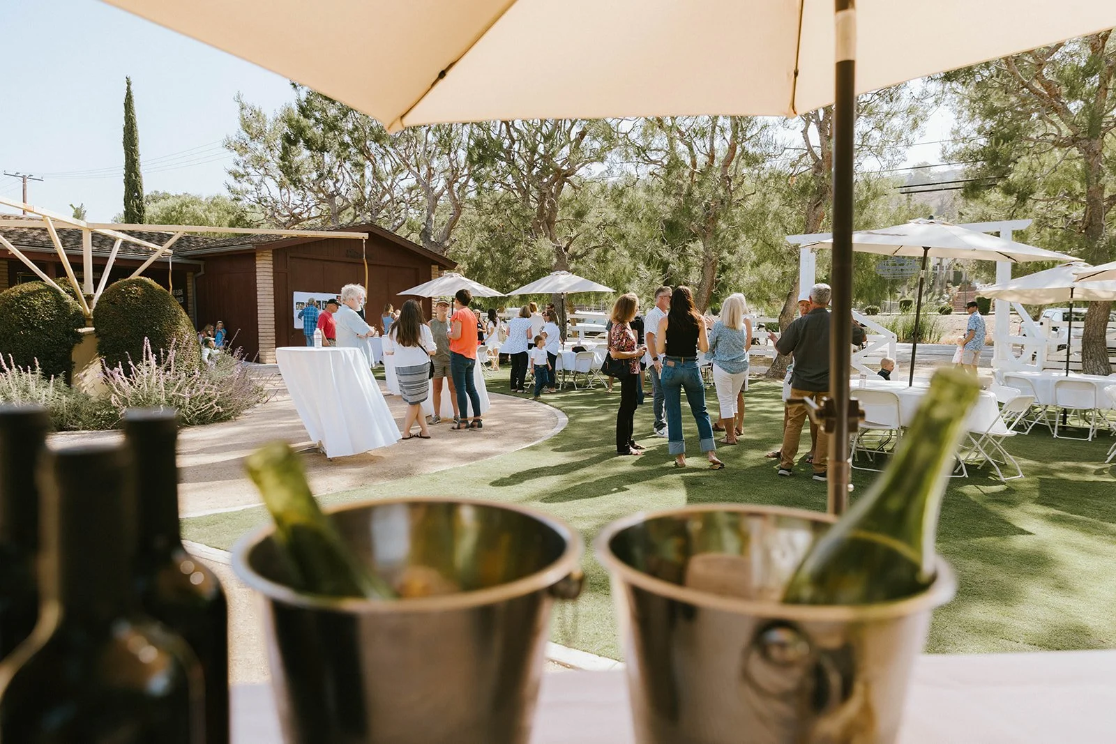 Guests interacting and angling at upscale birthday party at Nellie Gail Ranch in Laguna Hills - Orange County event photographer Tesla Rae Photo