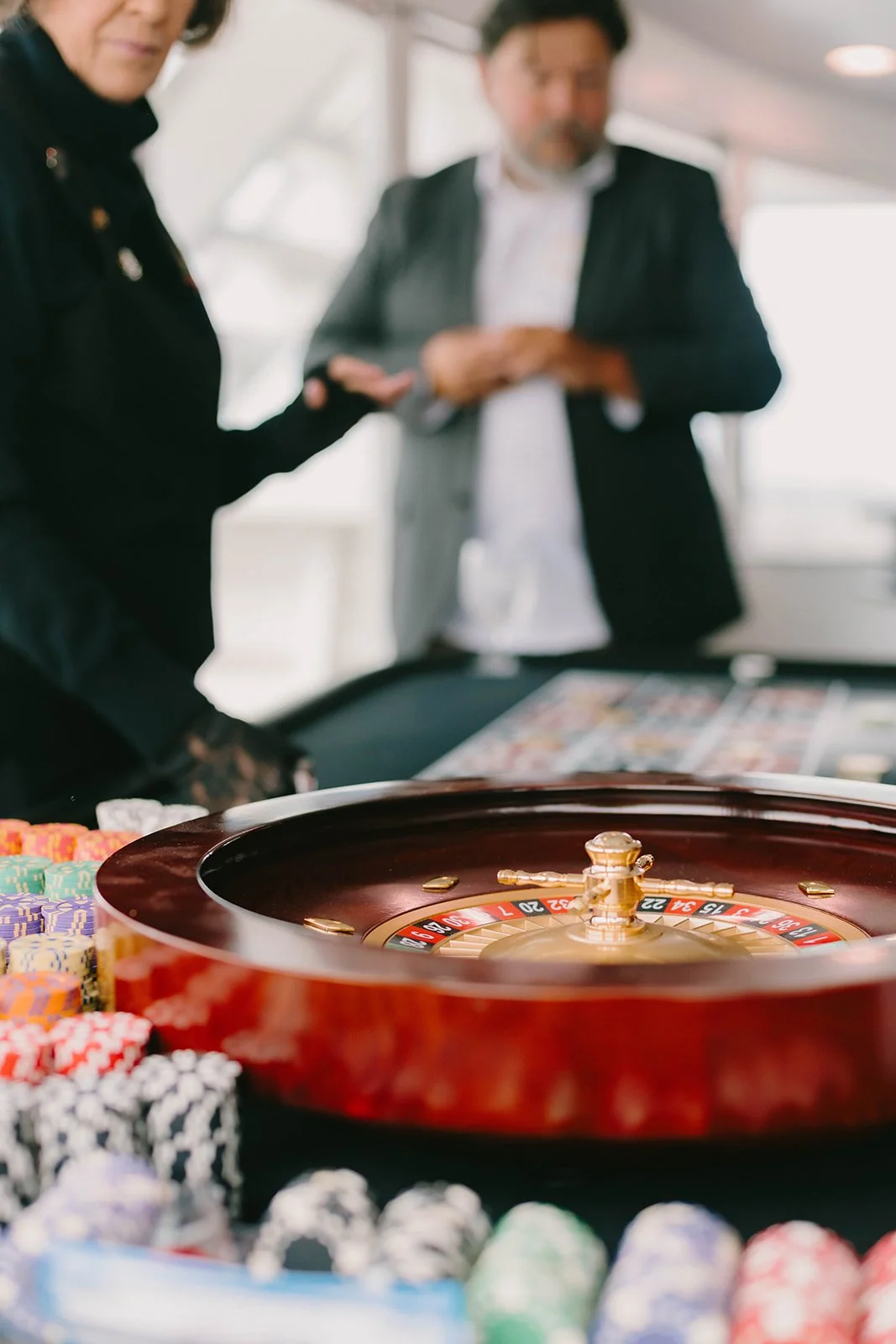 Poker table on a yacht at Newport Beach anniversary party  — Orange County event photographer Tesla Rae Photo