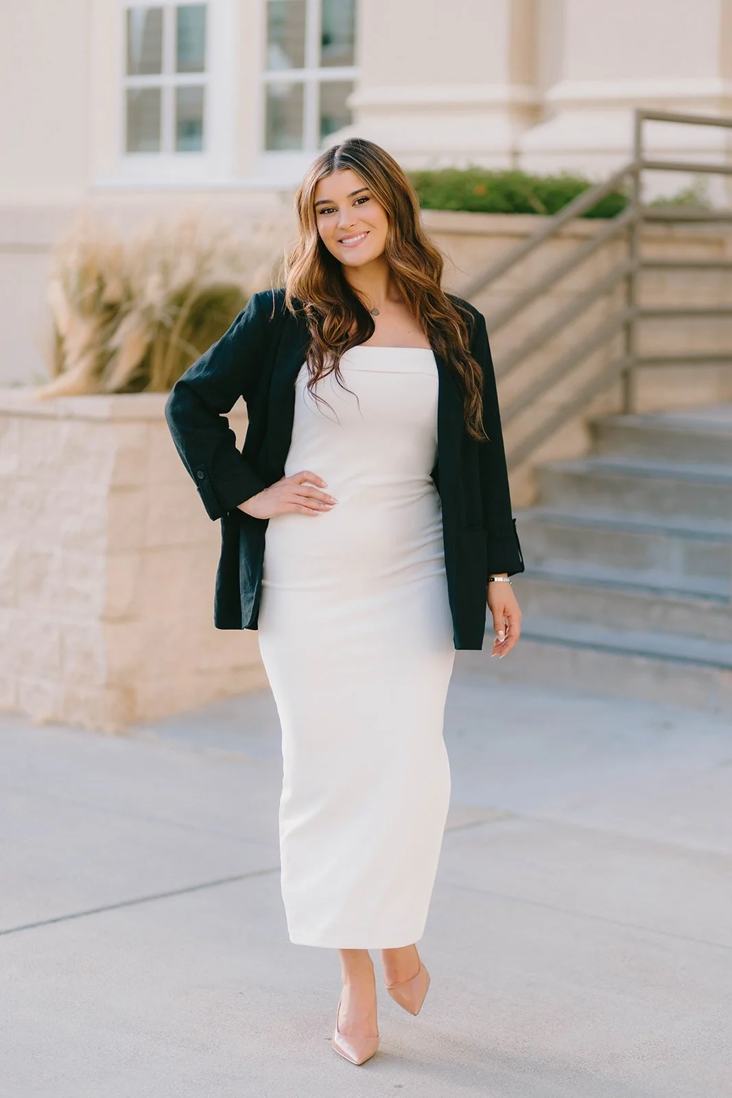 Grad celebrating with lifestyle portraits on Chapman University campus in Orange — Best graduation photographers in Orange County for authentic moments — Captured by Tesla Rae Photo