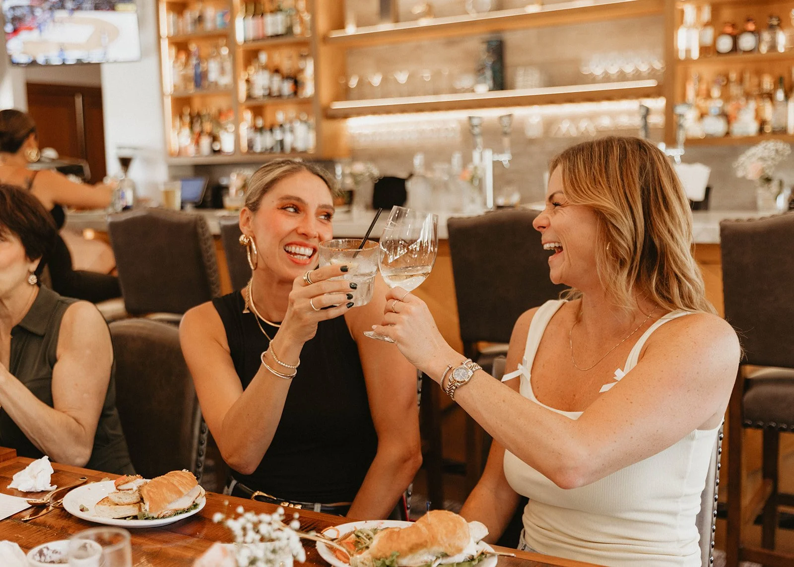 Friends cheering champagne at upscale baby shower at Nellie Gail Ranch Clubhouse in Laguna Hills - Orange County event photographer Tesla Rae Photo