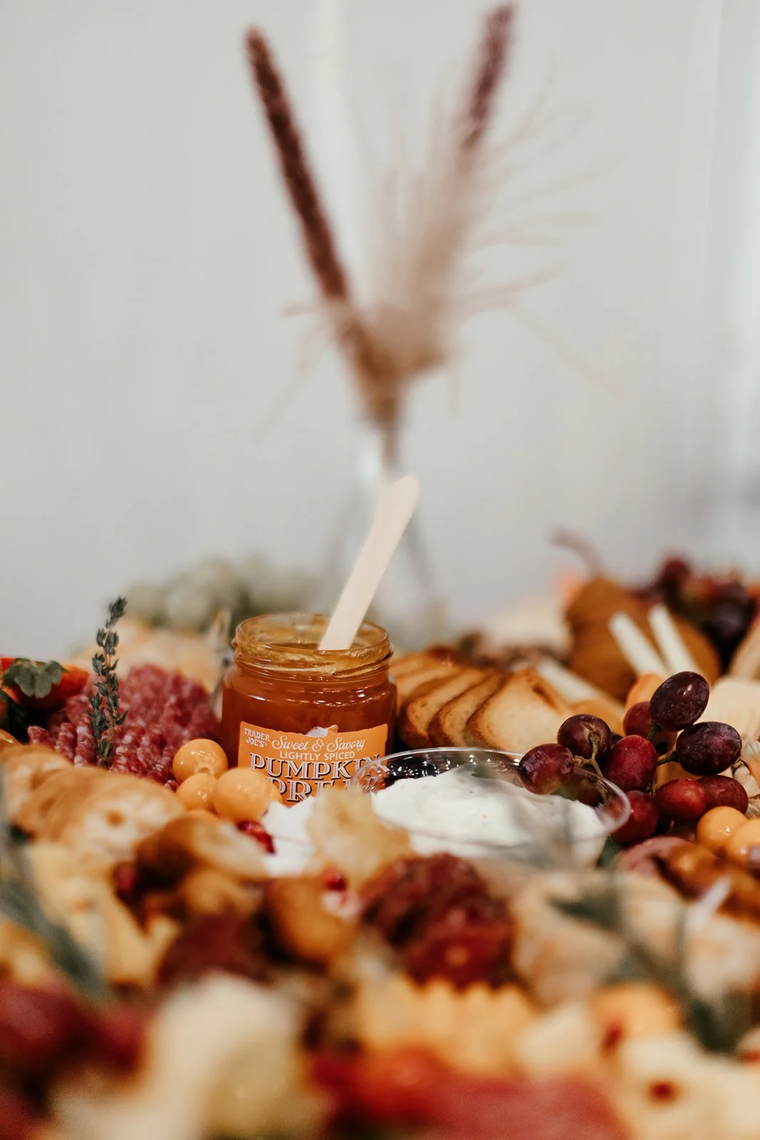 Luxurious table setting details and charcuterie, grazing table at upscale baby shower at Fullerton Arboretum.