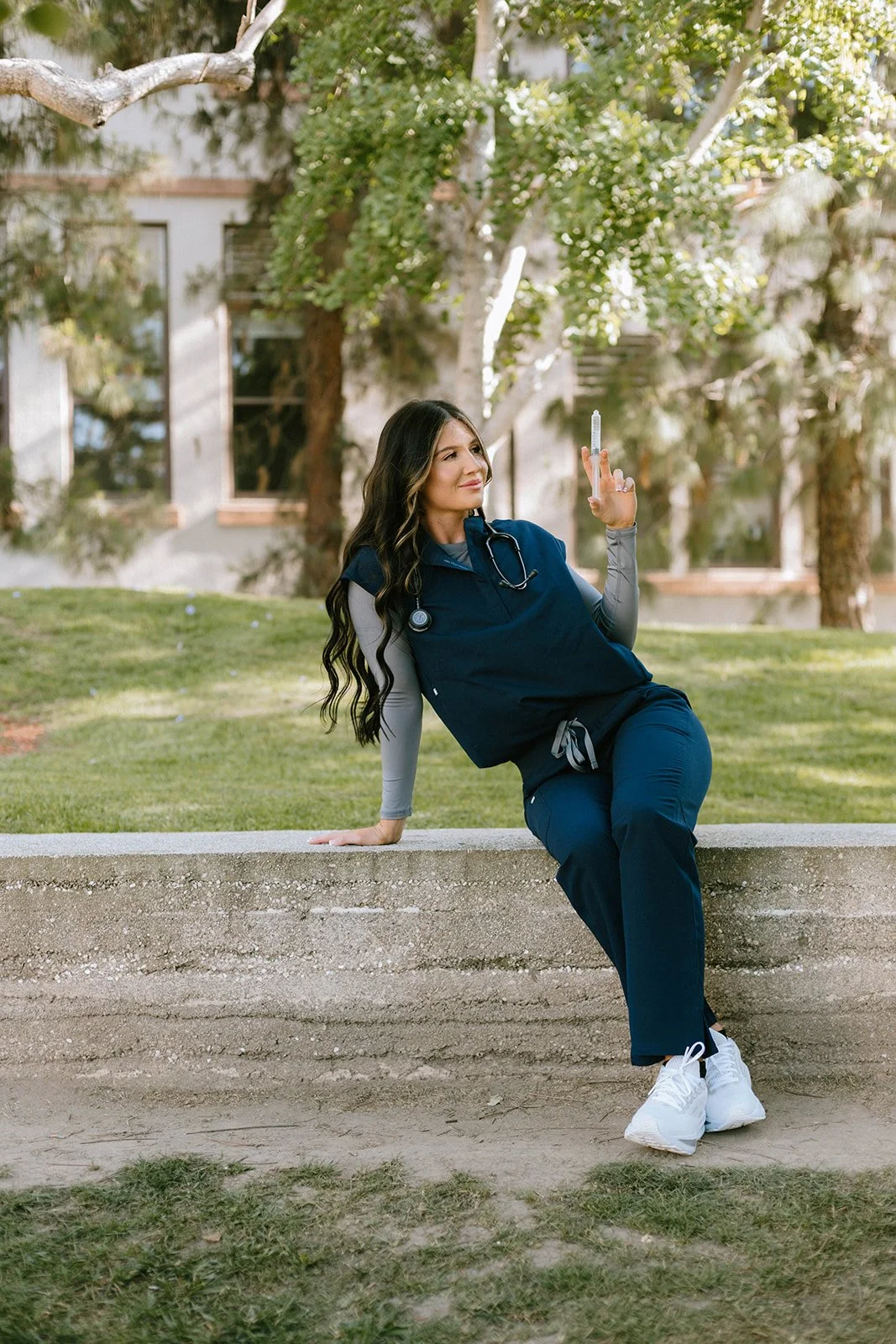 Grad celebrating with lifestyle portraits on Chapman University campus in Orange — Best graduation photographers in Orange County for authentic moments — Captured by Tesla Rae Photo