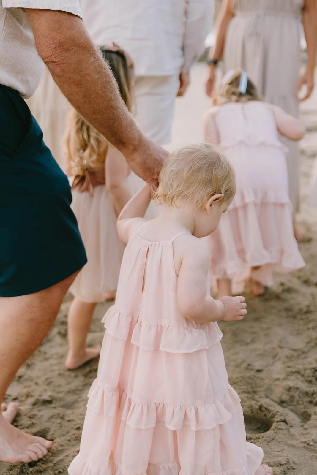 Carefree family laughing and playing at Laguna Beach — Best candid family photographers in Laguna Beach — Captured by Tesla Rae Photo