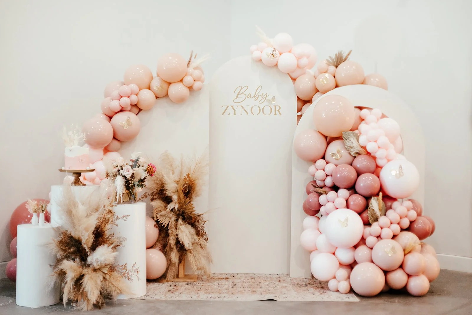 Elegant balloon arch, photo backdrop at high-end baby shower at Fullerton Arboretum — Luxury event photographer Tesla Rae Photo based in Southern California