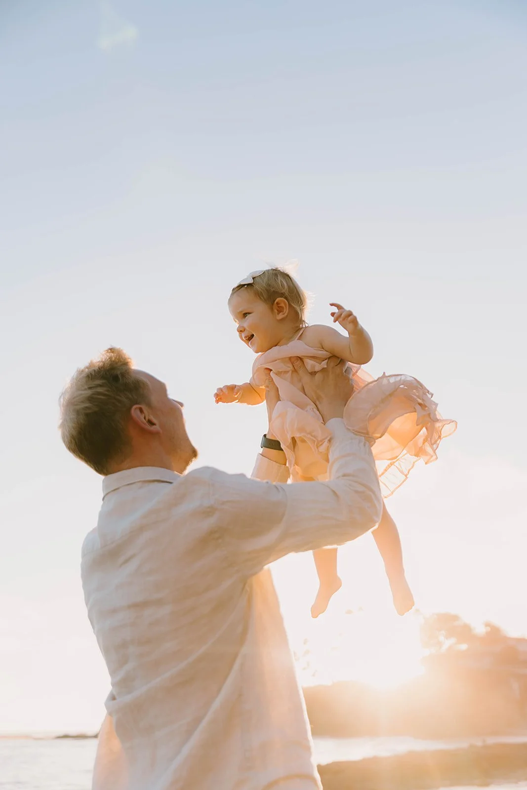 Carefree family laughing and playing at Laguna Beach — Best candid family photographers in Laguna Beach — Captured by Tesla Rae Photo