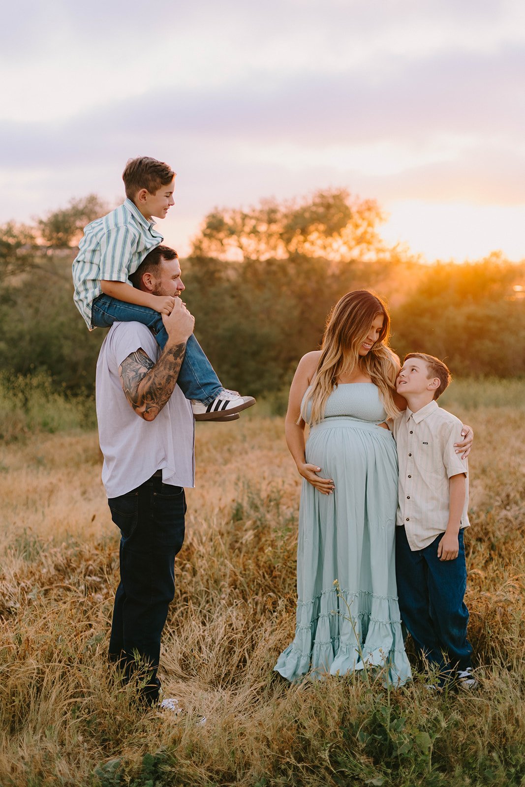 Family maternity session at sunset in golden field in Huntington Beach — Best maternity photographers in Orange County — Tesla Rae Photo