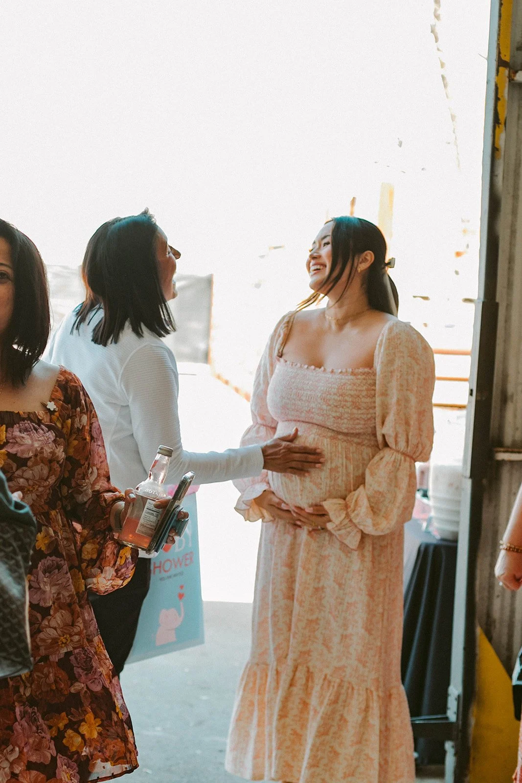 Candid shot of pregnant women mingling with her guest's at baby shower at Still Interior event space in Costa Mesa — Orange County event photographer Tesla Rae Photo
