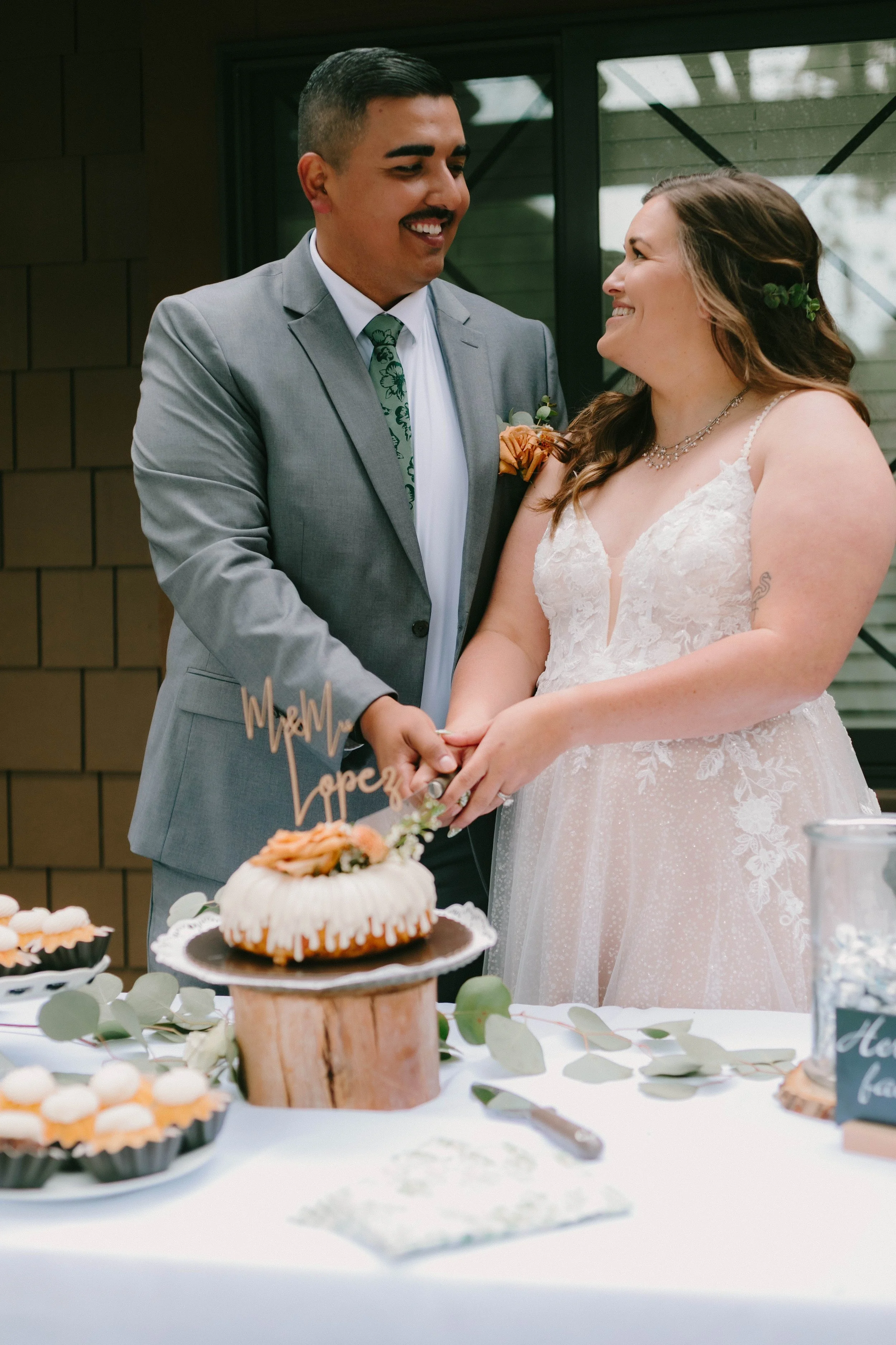 Bride and groom cutting wedding cake at Santiago Oaks Regional Park in Orange, CA — Southern California wedding photographer Tesla Rae Photo based in Huntington Beach