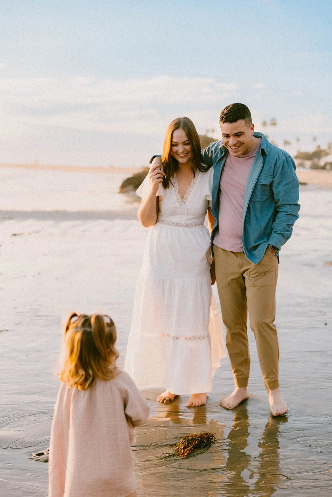 Carefree family laughing and playing at Laguna Beach — Best candid family photographers in Laguna Beach — Captured by Tesla Rae Photo