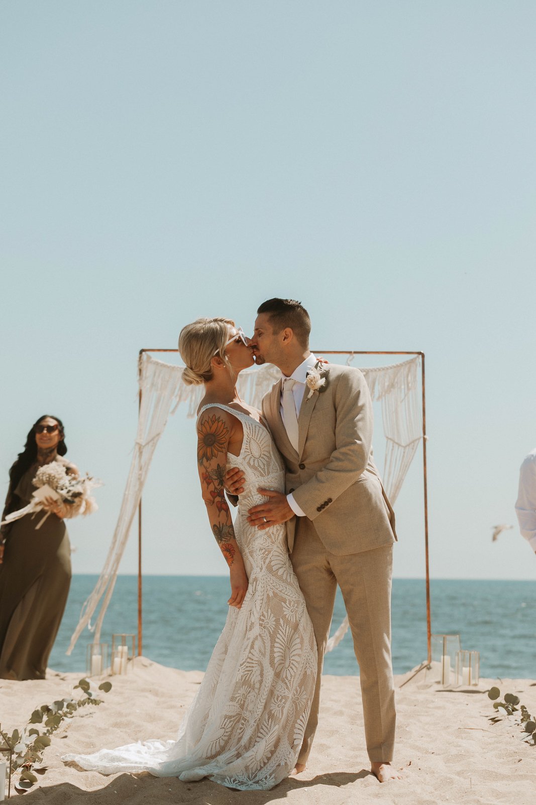 Bride and groom sharing their first kiss at their Newport Beach wedding— Southern California wedding photographer Tesla Rae Photo based in Huntington Beach