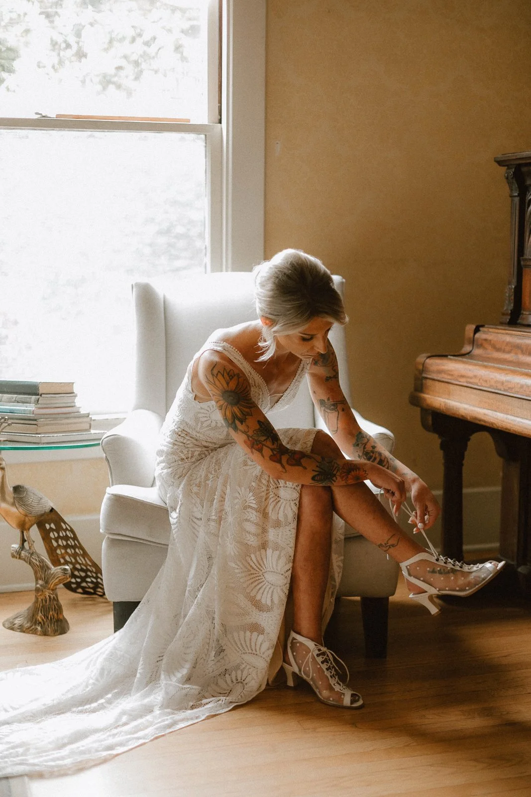 Bride putting on her heels at The French Estate wedding in Orange, CA — Southern California wedding photographer Tesla Rae Photo based in Huntington Beach