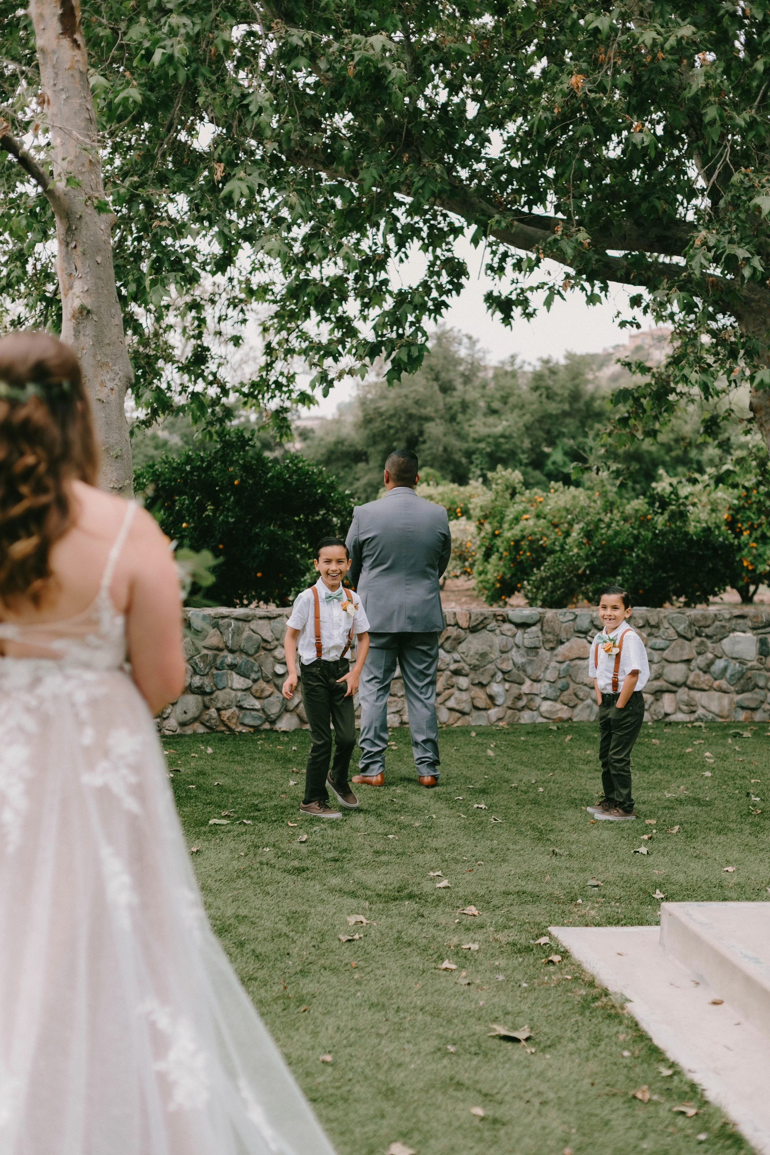 Bride and groom first look in the orange groves at Santiago Oaks Regional Park in Orange, CA — Southern California wedding photographer Tesla Rae Photo based in Huntington Beach