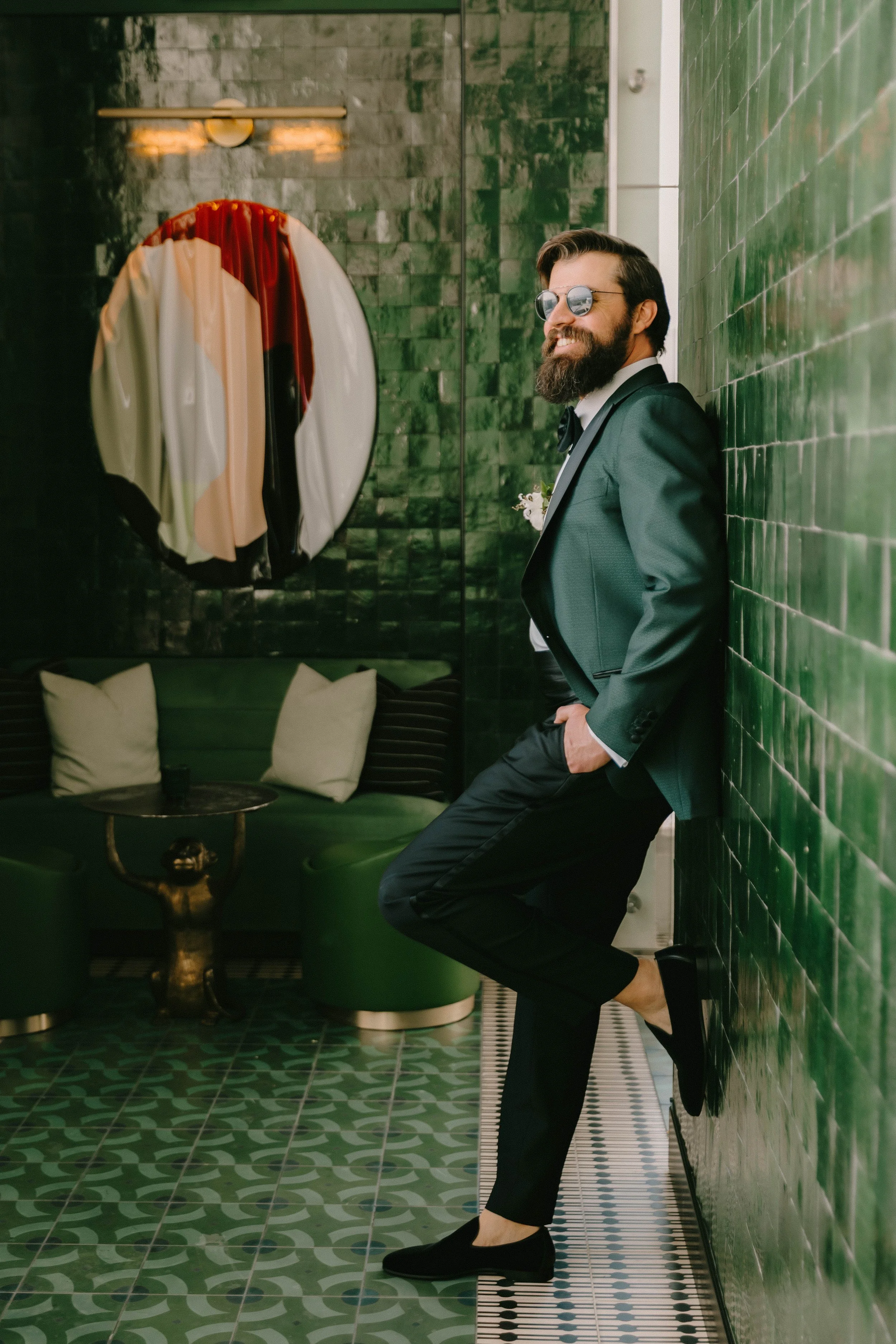 Portrait of groom standing against wall at Fairmont Breakers Hotel in Long Beach — Southern California wedding photographer Tesla Rae Photo based in Huntington Beach