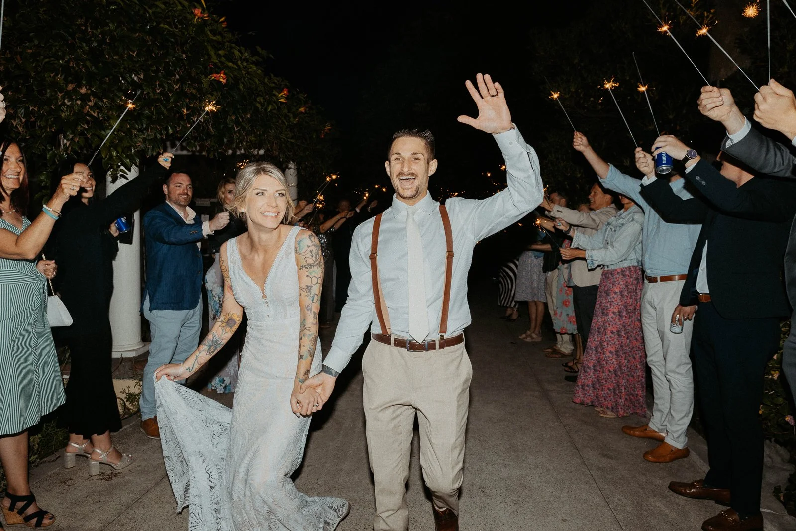 Bride and groom doing there grand exit at The French Estate wedding in Orange, CA — Southern California wedding photographer Tesla Rae Photo based in Huntington Beach