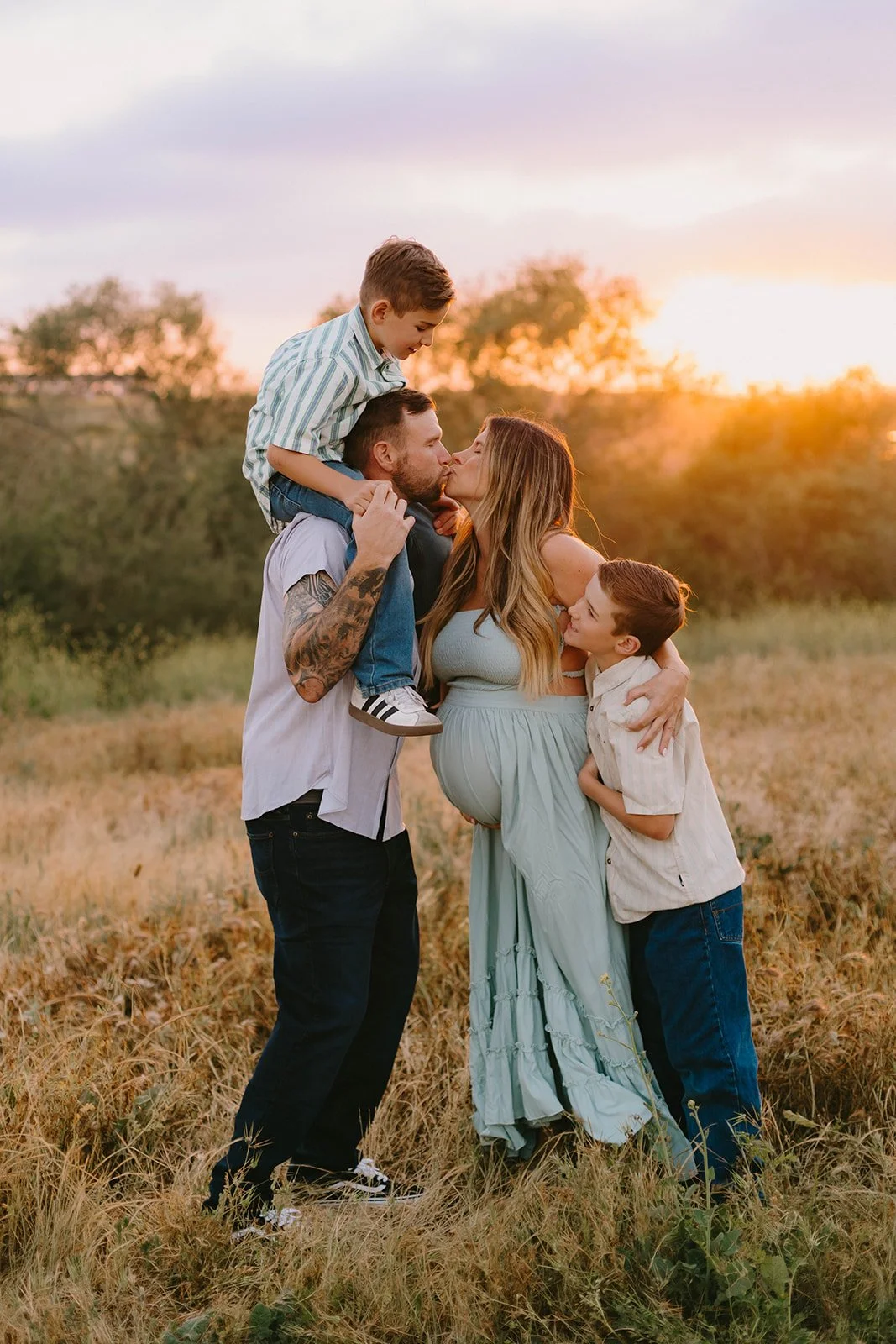 Family maternity session at sunset in golden field in Huntington Beach — Best maternity photographers in Orange County — Tesla Rae Photo
