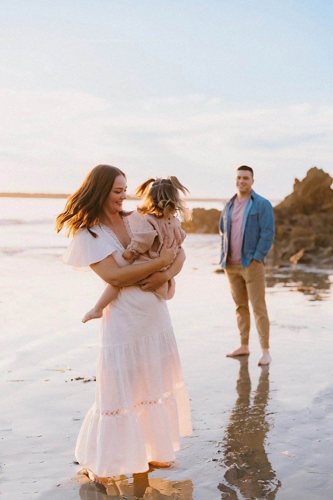 Carefree family laughing and playing at Laguna Beach — Best candid family photographers in Laguna Beach — Captured by Tesla Rae Photo
