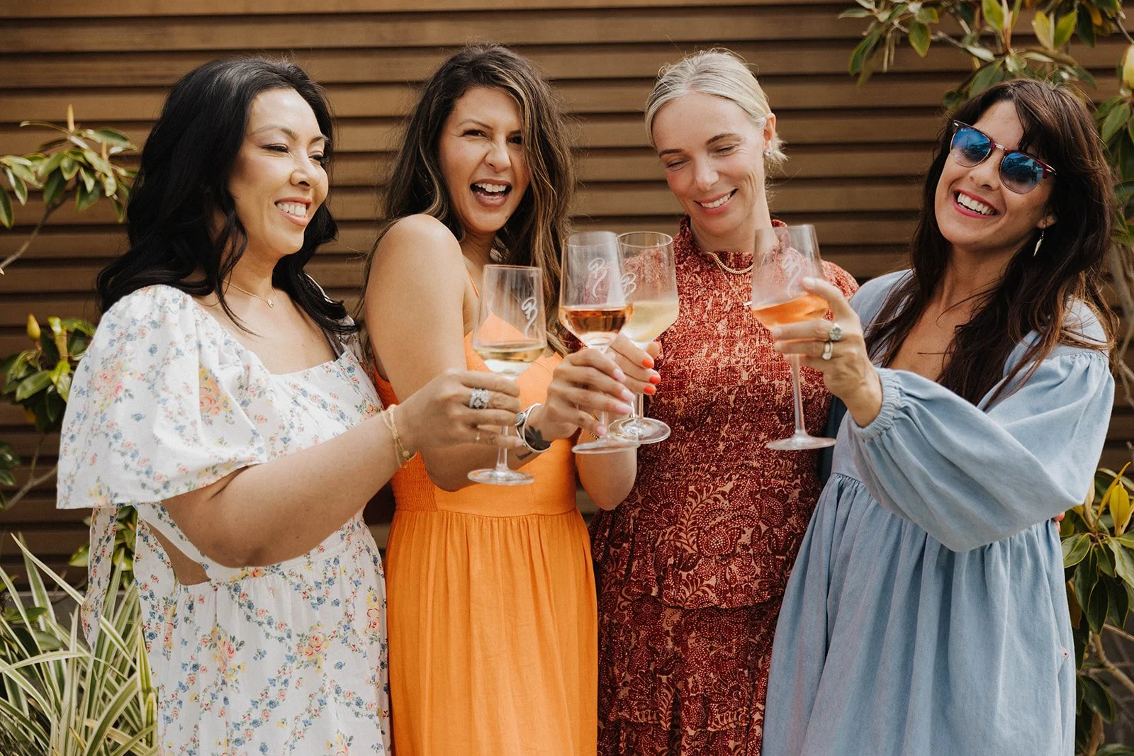 Champagne toast at intimate ladies' networking event at Bianchi Laguna Beach— Luxury event photographer Tesla Rae Photo based in Southern California