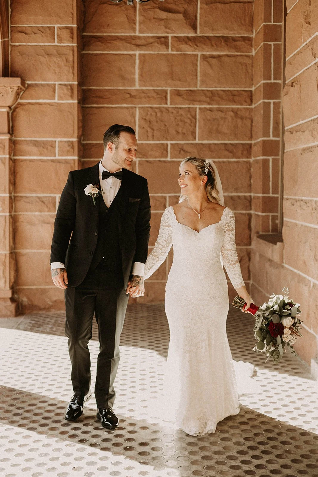 Bride and groom portrait at their courthouse elopement at the Old Orange County Courthouse in Santa Ana — Southern California wedding photographer Tesla Rae Photo based in Huntington Beach