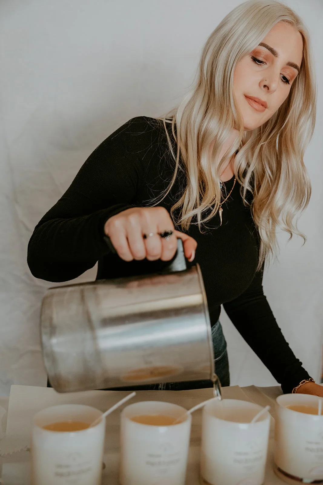 Artisan pouring soy wax for handmade candles during a branding session — Best product photographers in Orange County for makers — Captured by Tesla Rae Photo