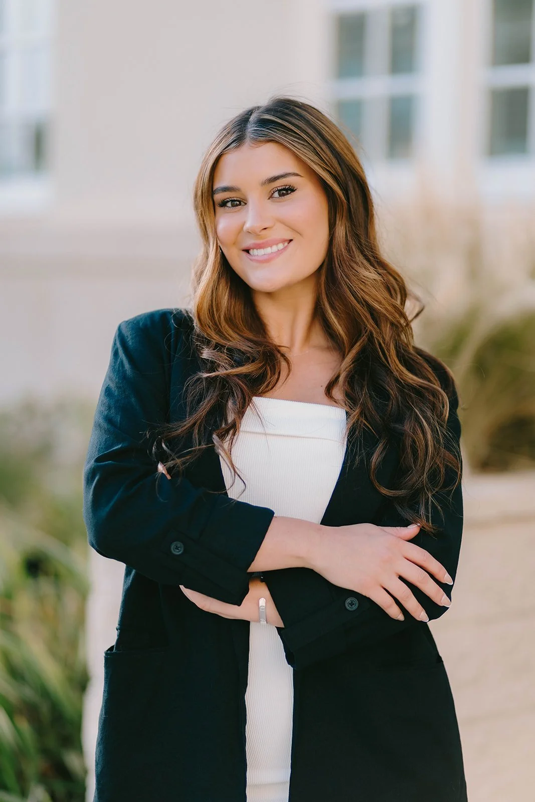 Grad celebrating with lifestyle portraits on Chapman University campus in Orange — Best graduation photographers in Orange County for authentic moments — Captured by Tesla Rae Photo