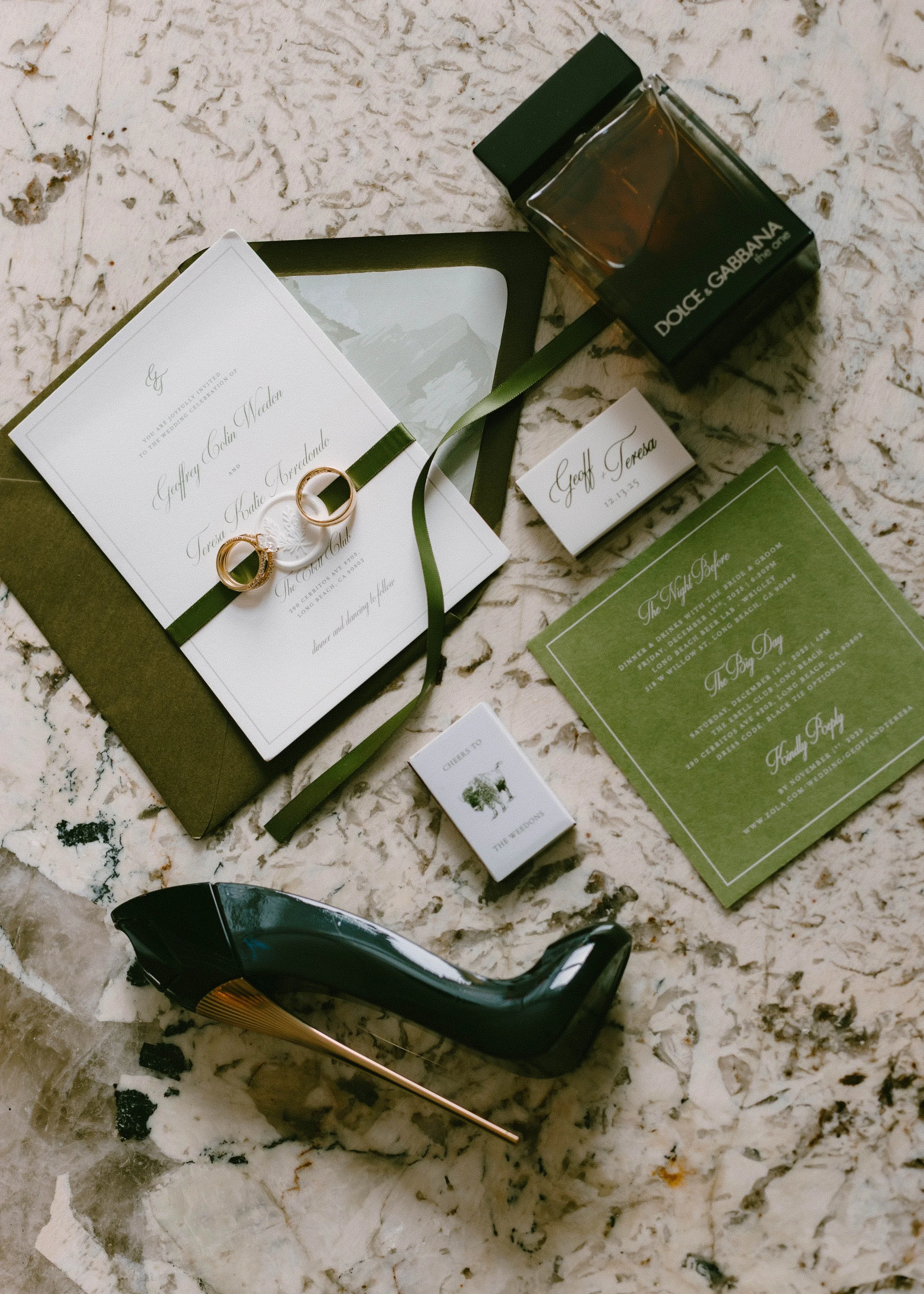 Bridal flat lay details featuring wedding rings, invitations, and cologne at Long Beach wedding — Long Beach wedding photographer Tesla Rae Photo