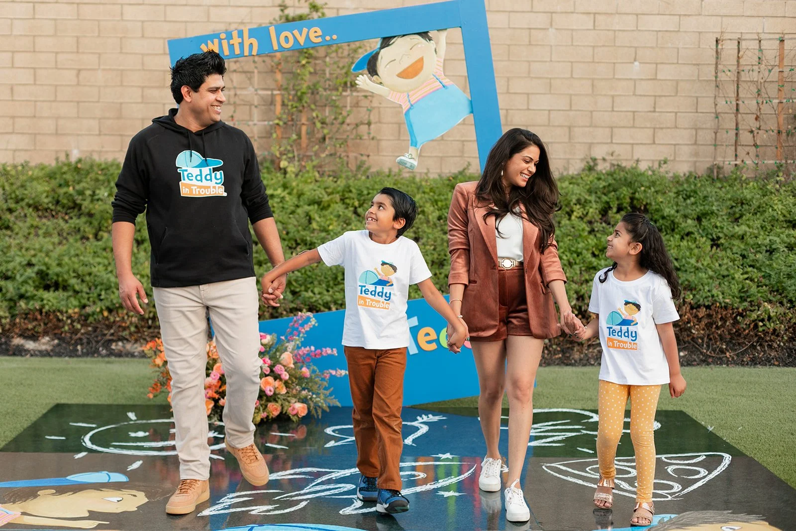 Candid shot of Author and family walking  at "Teddy in Trouble" children's book release party in Irvine — Orange County event photographer Tesla Rae Photo