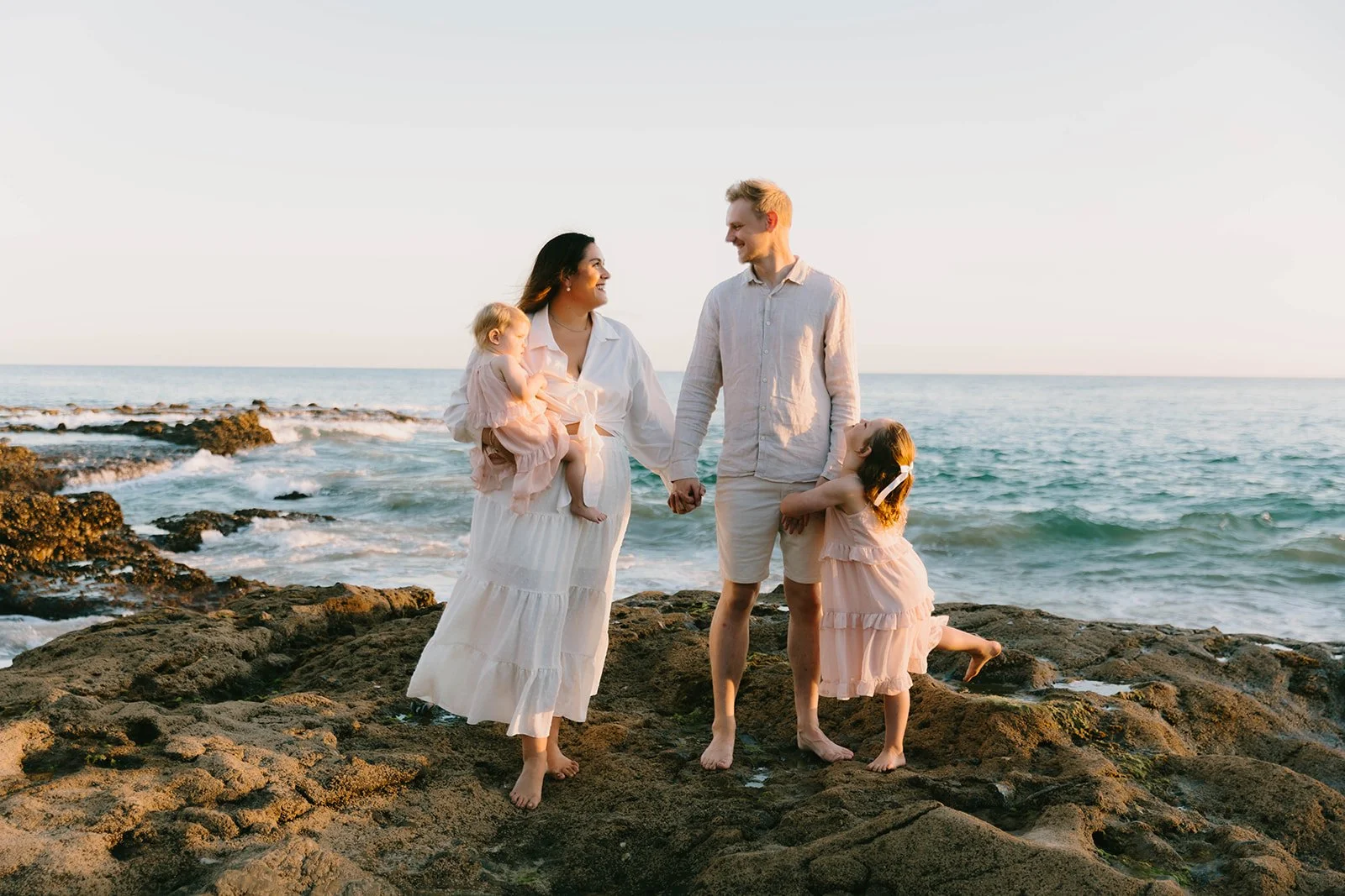 Carefree family laughing and playing at Laguna Beach — Best candid family photographers in Laguna Beach — Captured by Tesla Rae Photo