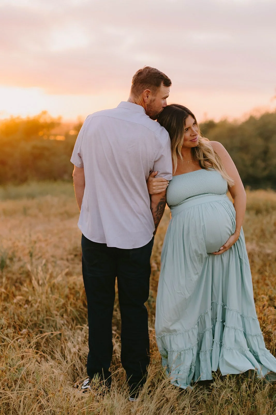 Couples maternity session at sunset in golden field in Laguna Beach — Best maternity photographers in Orange County — Tesla Rae Photo