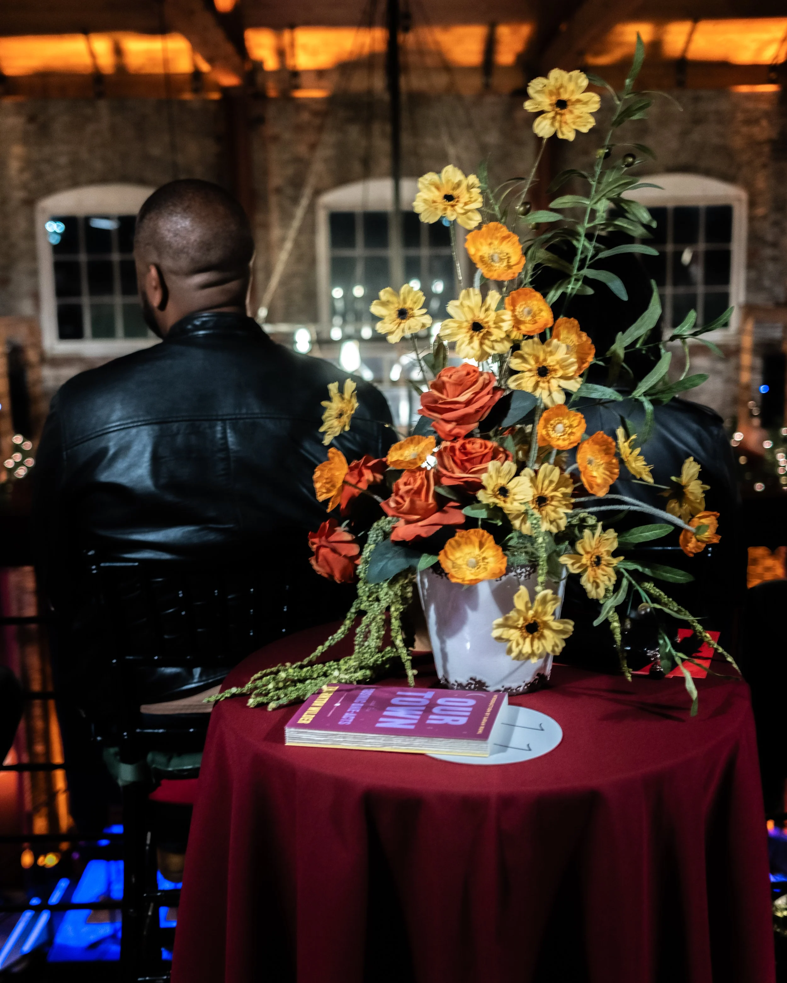 Copy of Flowers, book copy and audience member.jpg