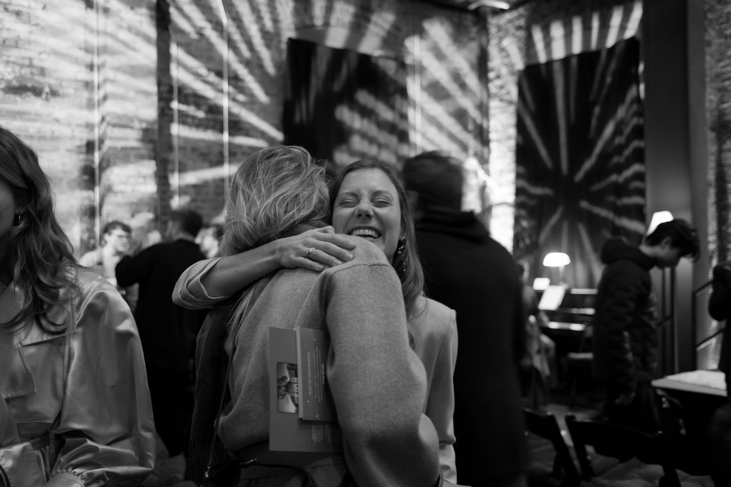Copy of Emma hugging and smiling B&W.jpg