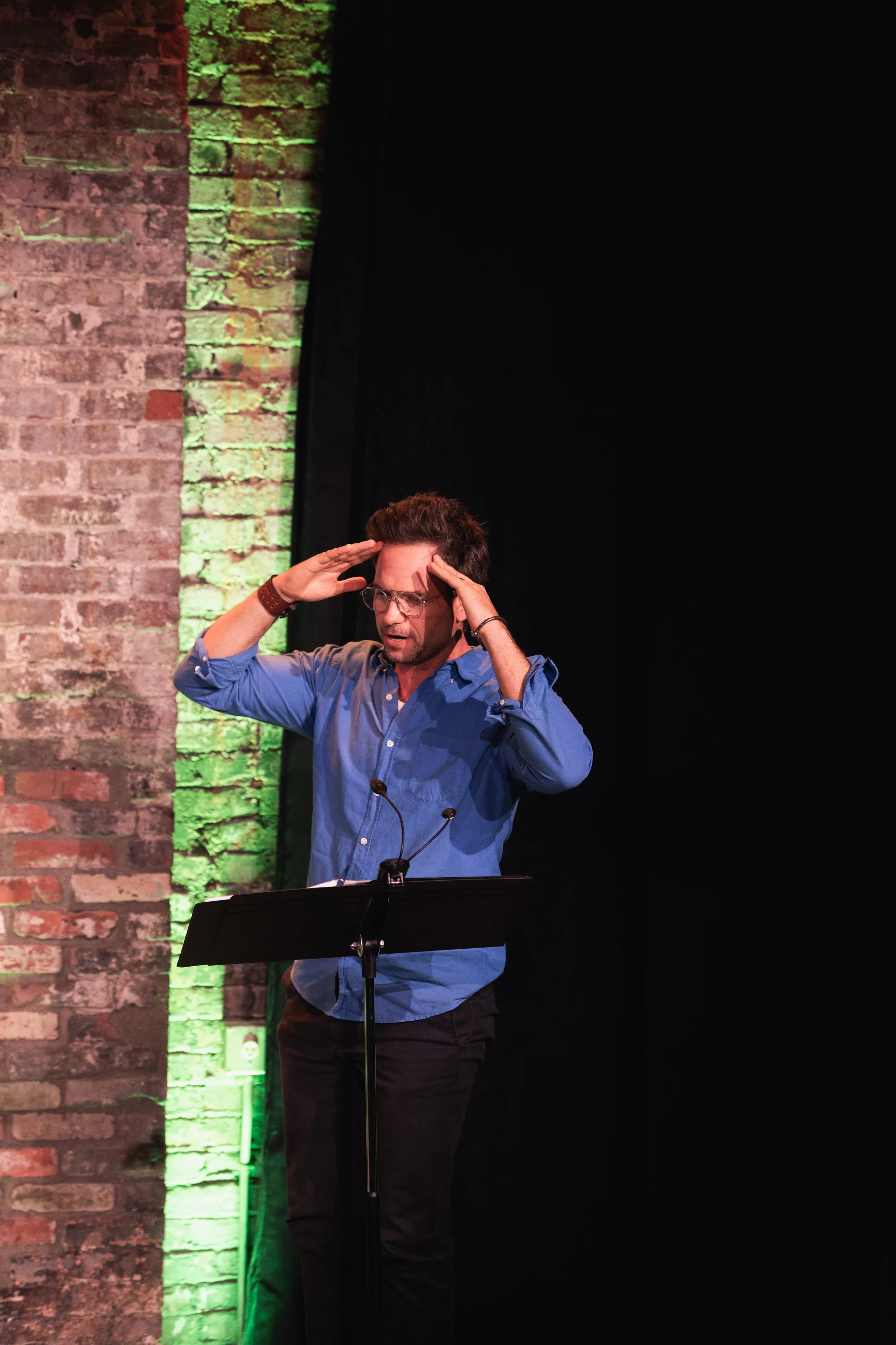 Copy of Patrick solo gesturing onstage.jpg